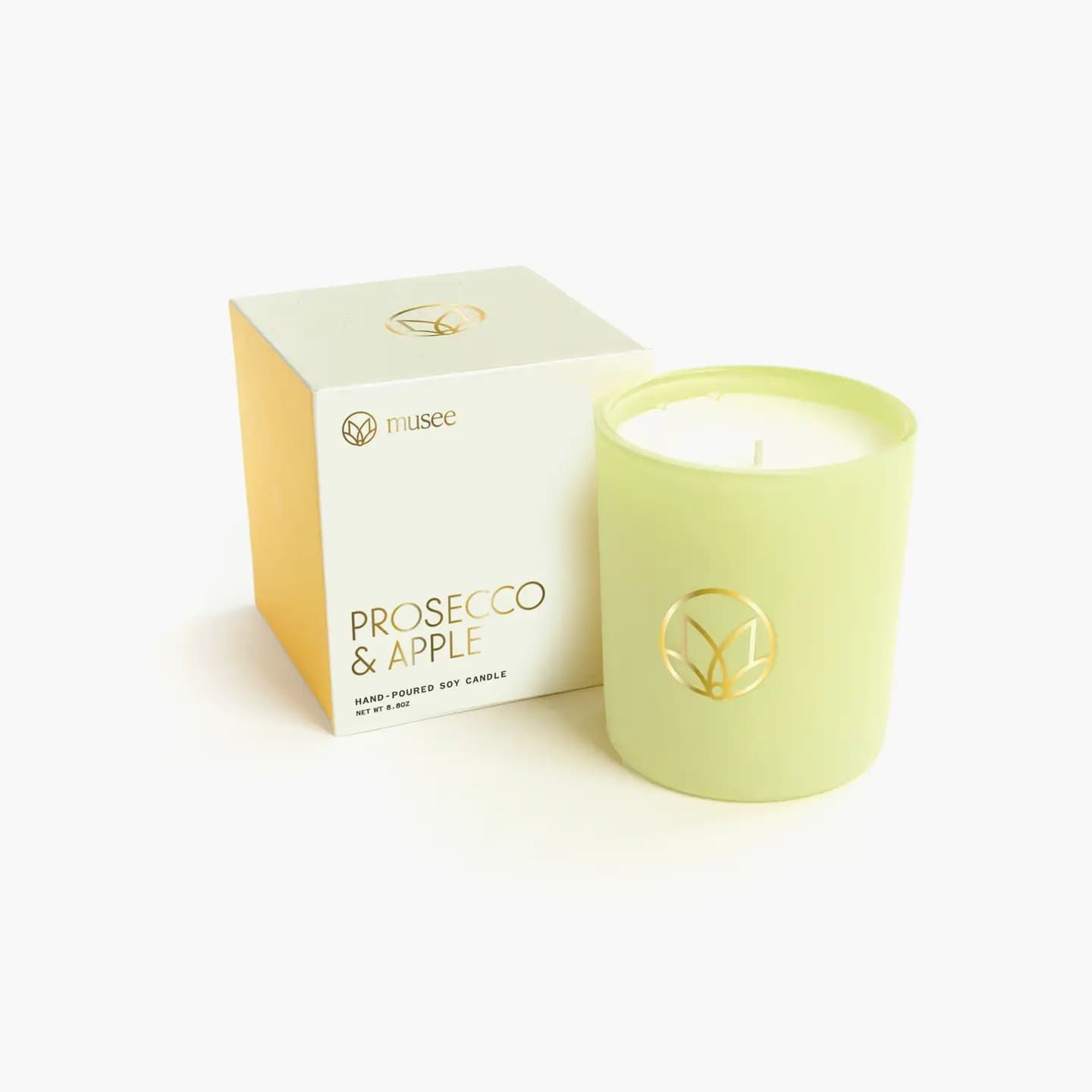 Musee Prosecco &amp; Apple Candle - Sweet blend of refreshing prosecco, crisp apple, white grapes and and fruity cork. Quote inside box- &quot;As we let our own light shine, we give others permission to do the same.&quot; -Nelson Mandela.  Soy wax is the key ingredient for our candles. Soy candles have a cleaner burning with no toxins or pollutants. They burn slowly so the scent is gradually released, creating a pleasant atmosphere for any space.