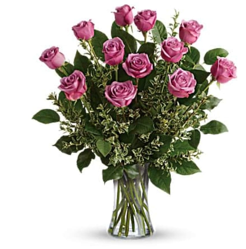 Hey Gorgeous Bouquet Hey Gorgeous Bouquet - A gorgeous greeting for any occasion, this lovely lavender bouquet features one dozen radiant roses with lush greens in a classic glass vase. This gorgeous bouquet includes 12 lavender roses, oregonia, and lemon leaf. Delivered in a glass gathering vase.