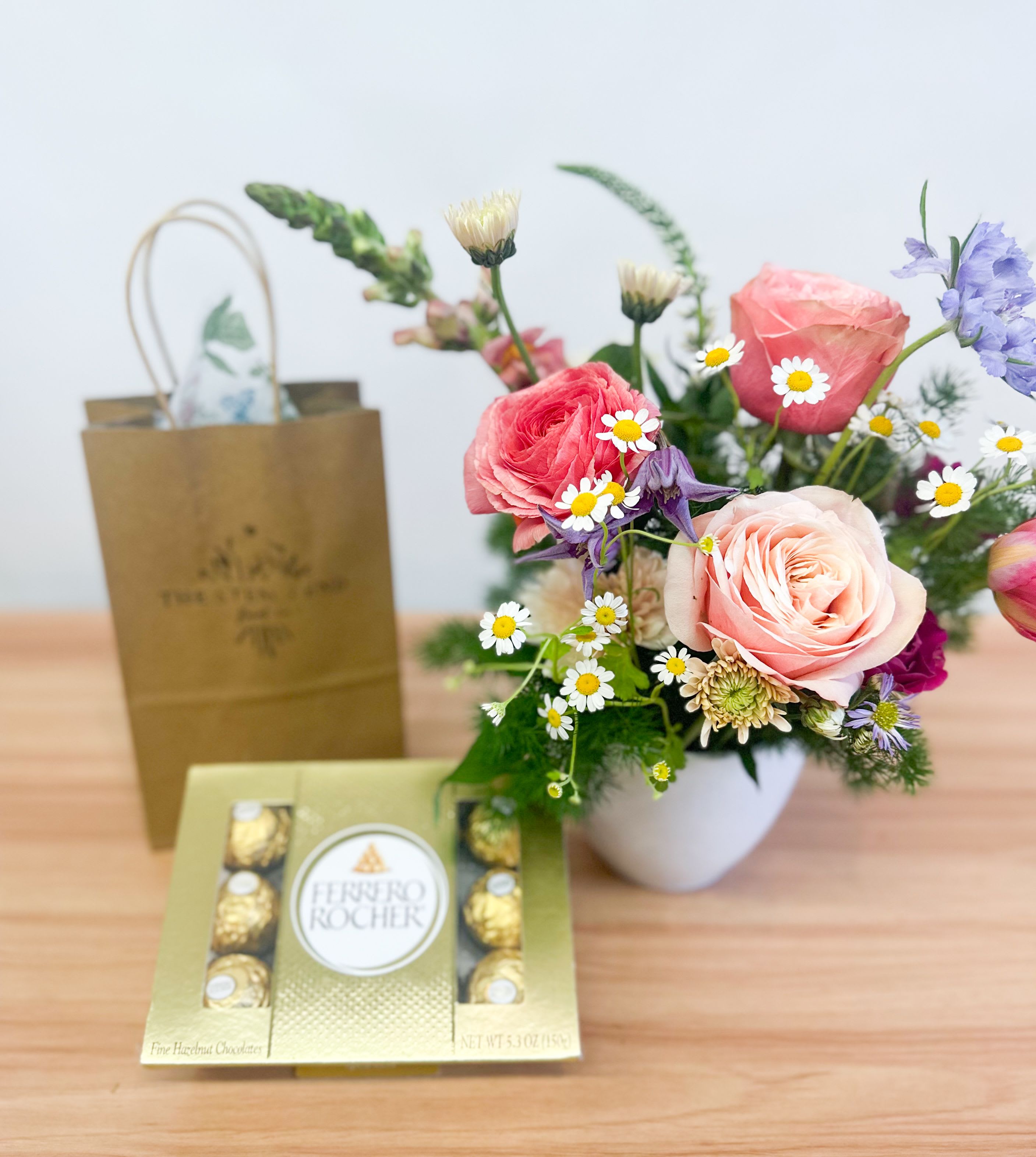 Petite Flower Field Bundle - Brighten someone's day with our petite Flower Field arrangement, featuring a delightful mix of blooms that bring a touch of nature indoors. Paired perfectly with chocolates, this gift is not just a feast for the eyes but also a treat for the taste buds.