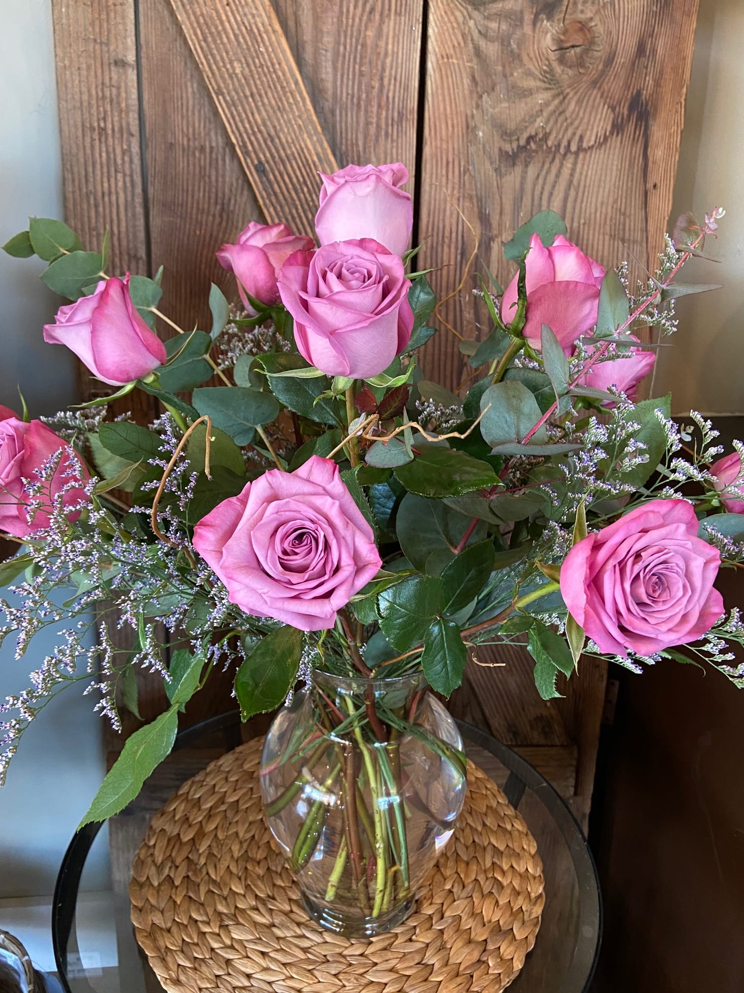 Dozen Long Stem Lavender Roses - Dozen long stem lavender roses with filler designed in a glass vase.