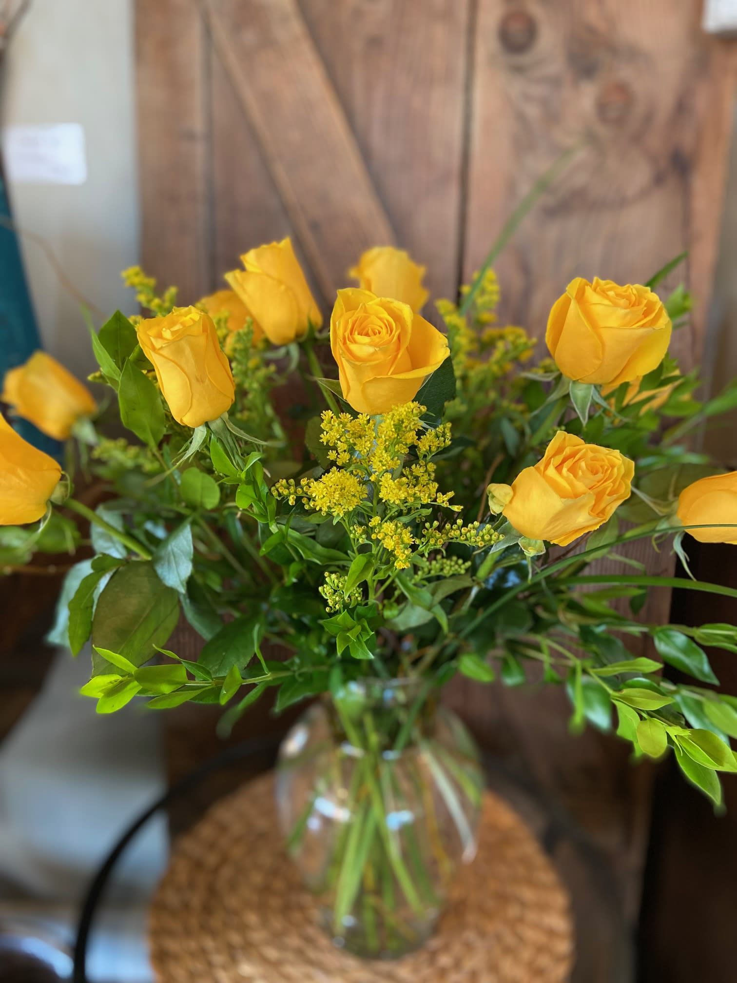 Dozen Long Stem Yellow Roses - Dozen long stem yellow roses designed in a glass vase.