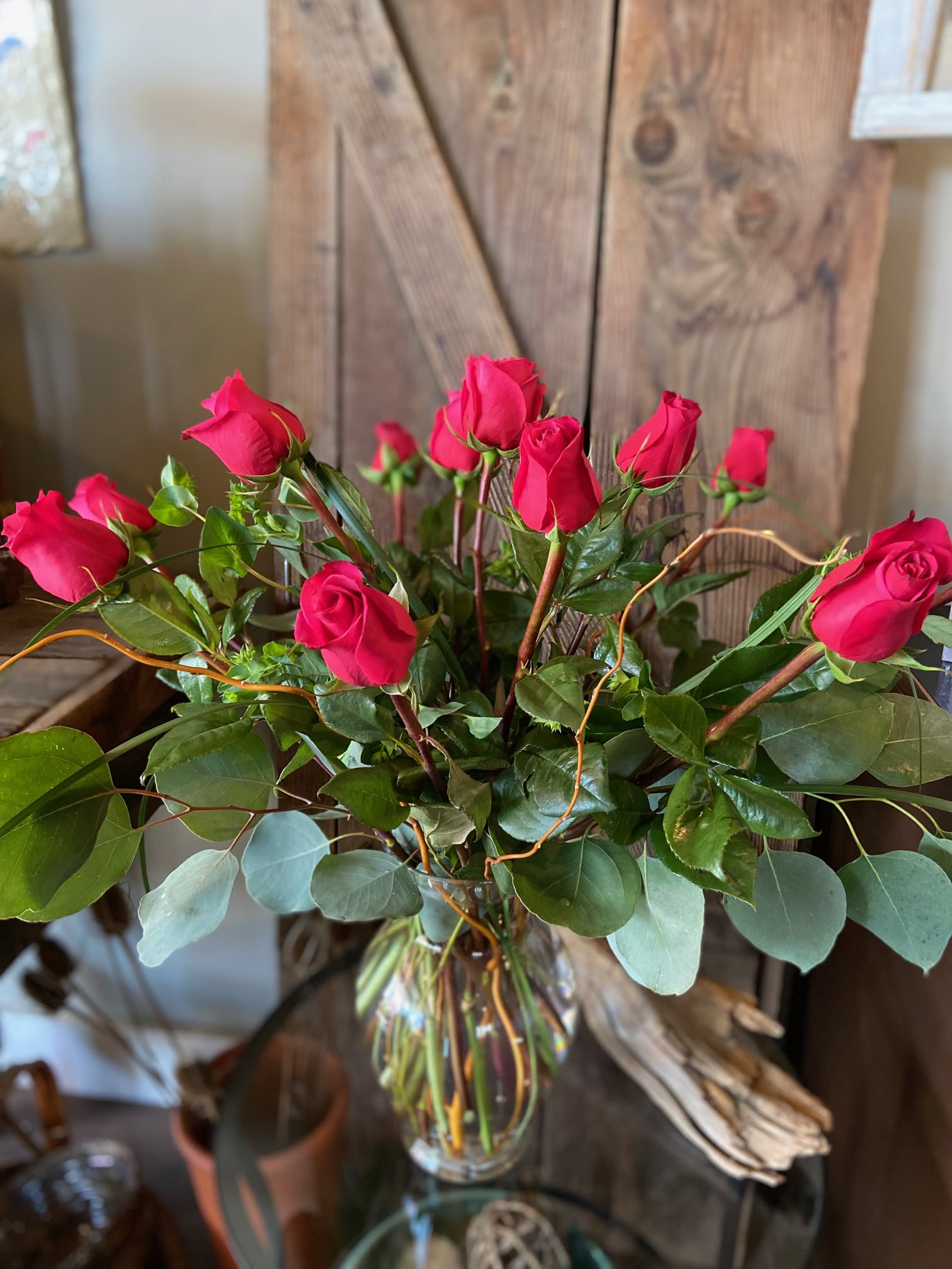 HOT Pink Roses - These Beauties are Deep HOT Pink!  One dozen arranged in a Elegant Clear Vase with Premium Greenery.