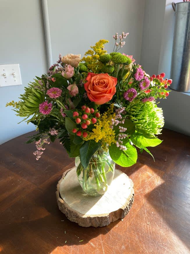 Life of the Party Life of the Party - Celebrate good times with this lively bouquet. The arrangement includes roses, carnations, alstroemeria, stock, aster, and other seasonal blooms. This is the perfect gift for Mother's Day, Birthday, or Just Because. APPROXIMATE DIMENSIONS: 12" D x 15"H