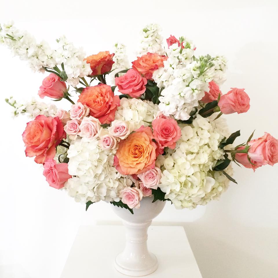 The Babette The Babette - This fabulous fluffiness reminds me of a creamsicle on a beautiful late spring, early summer day. Designed with white hydrangeas, beautiful white stock and free spirit garden roses with a smattering of light pink spray roses, this arrangement is such a fresh burst of color.
