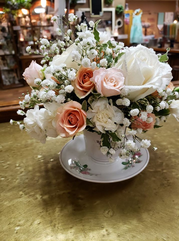 Victorian Teacup Victorian Teacup - Roses, spray roses and miniature carnations arranged in a teacup.