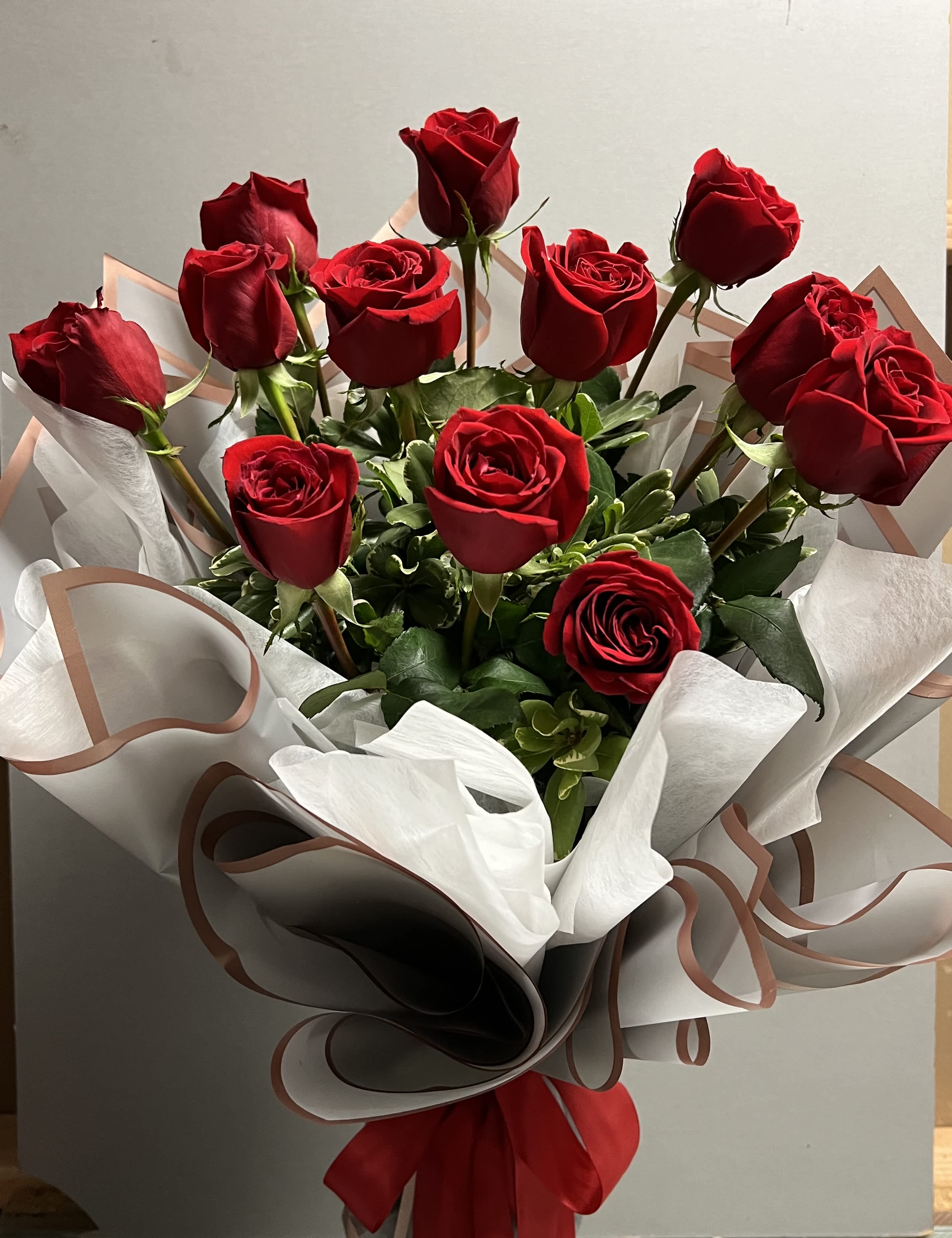1 Dz Wrapped Roses 1 Dz Wrapped Roses - 1 Dz Ecuadorian Roses AS SIMILAR AS POSSIBLE Substitution based on season, flowers availability or any unforeseen or uncontrollable circumstances