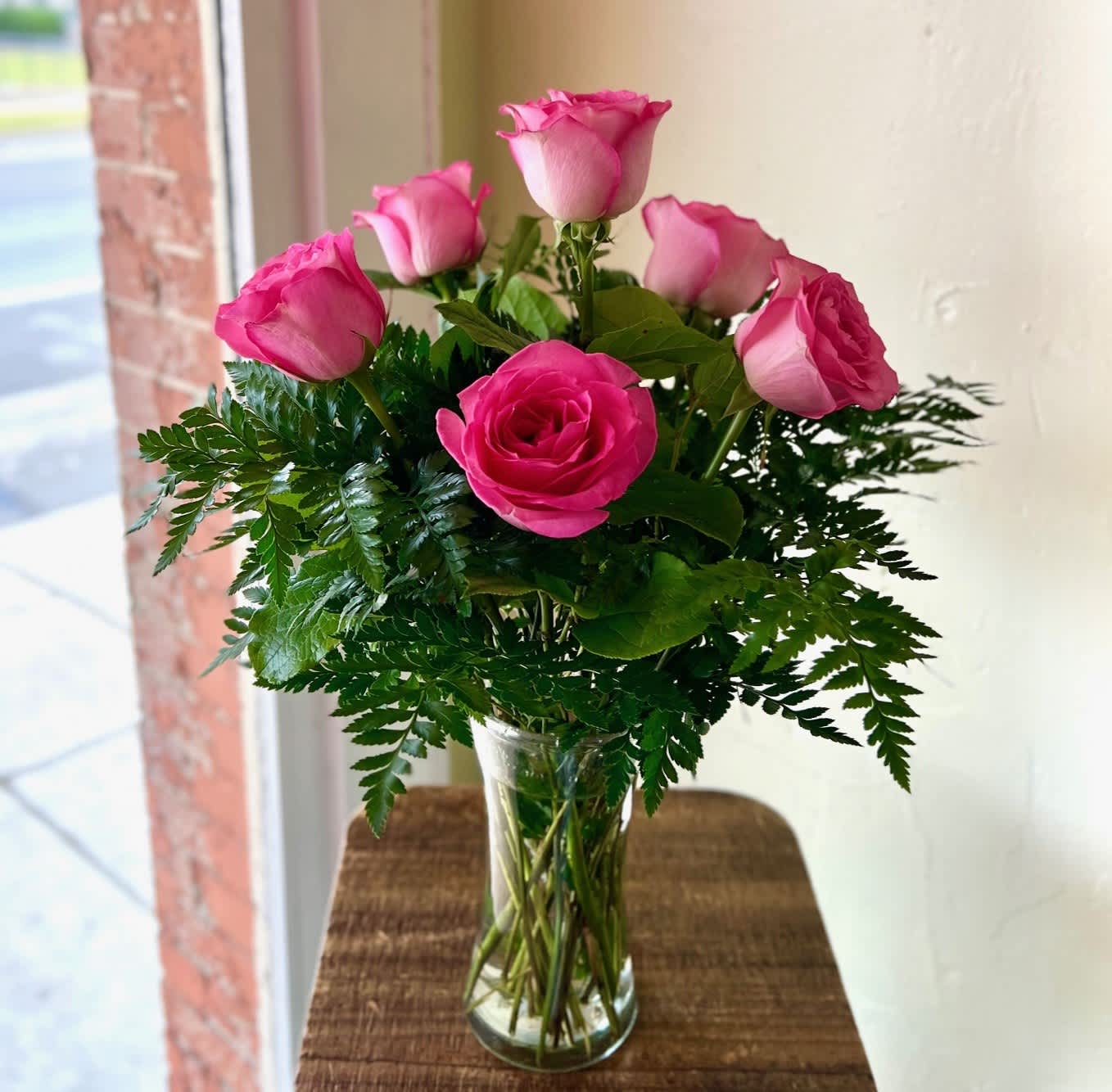 Pink Half Dozen Rose Pink Half Dozen Rose - Standard price is as pictured. Deluxe pricing includes accent flower and additional greens.
