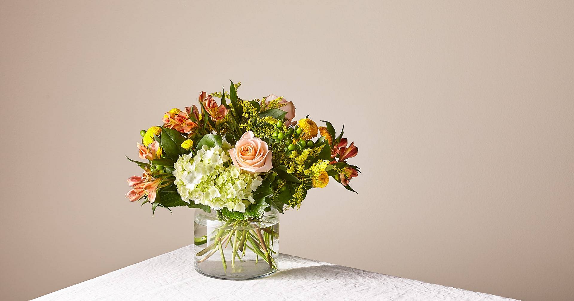 Antique peach by Kokee Antique peach by Kokee - An assortments of peaches colors in a cylinder vase beautiful and delicate just for your love ones to smile and be happy..