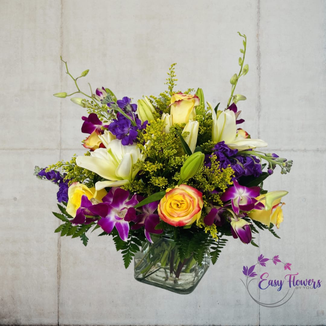 Magical Blooms Magical Blooms - Experience the Magic of Our Starlight Bouquet - For thousands of years, people have been fascinated by the natural world and the sparkling stars that light up the night sky. Our enchanting bouquet pays homage to this timeless fascination, featuring a dazzling array of vivid yellow roses, white lilies, and pink dendrobium orchids. Inspired by nature, this stunning arrangement evokes lovely sentiments and unforgettable memories. Whether you're looking for a gift for a special occasion or simply want to treat yourself, our Starlight Bouquet is sure to captivate and inspire.