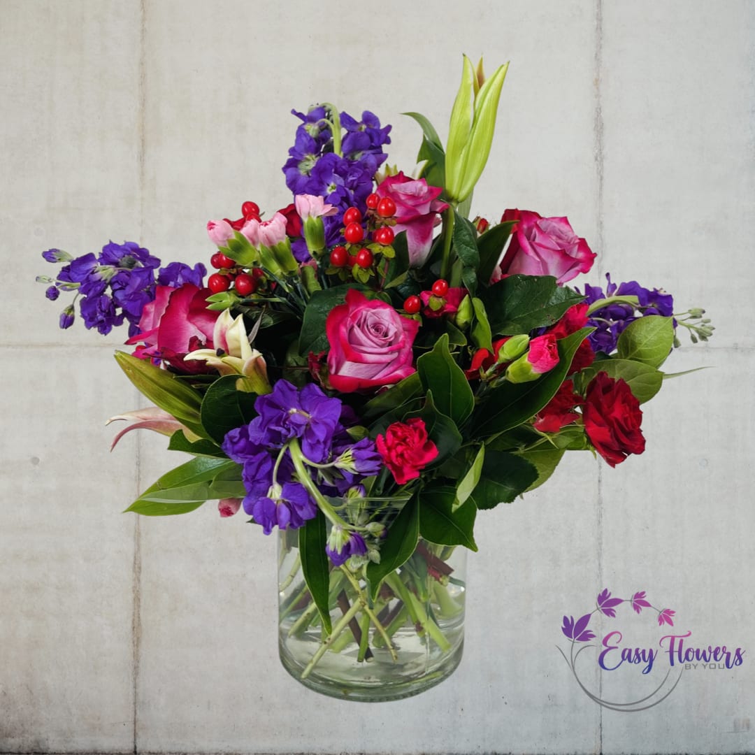 Lovely Inspiration Lovely Inspiration - Refresh your spirit with the beauty of a new day and a stunning arrangement of pink flowers. Our gorgeous display features pink mini carnations, red spray roses, fragrant lilies, light pink roses, and bright pink stock flowers, lightly arranged in a transparent vase. This breathtaking arrangement will leave you in awe, inspiring you with fresh feelings and renewed creativity.
