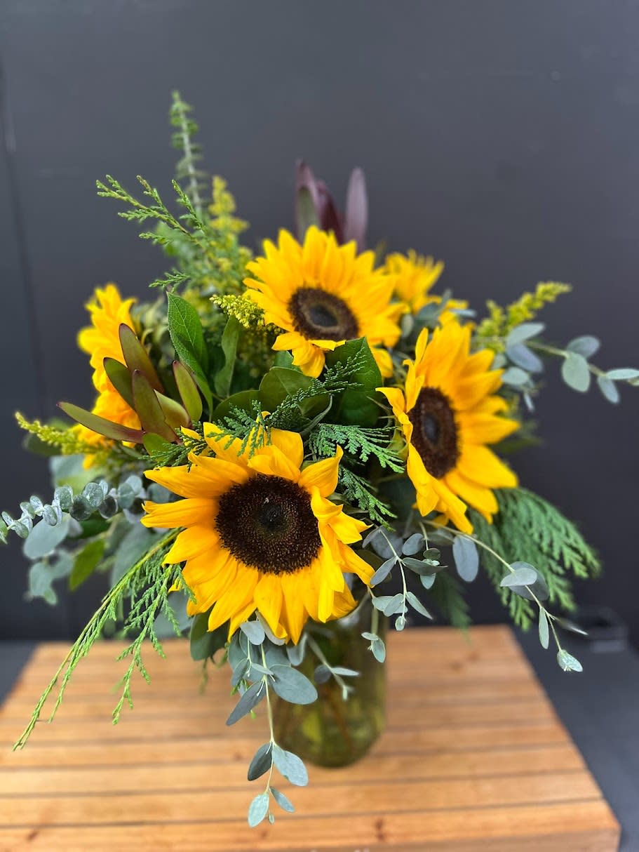 Vase of Sunflowers Vase of Sunflowers - This is an all around bouquet of sunflowers with greens and filler flowers. * Some stages of flower life may vary. (Example: Lilies may be more open than imaged.) Flower shortages and product availability means that some substitutions will apply. Value will always be filled. This bouquet might include eucalyptus amongst the greenery. It may be toxic to pets including but not limited to Cats and Dogs if digested.