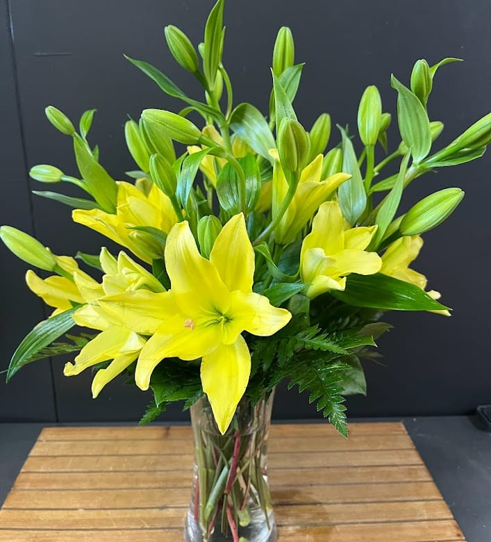Yellow Lilies - This bouquet is all around designed with Yellow Lilies and a mix of nice greens.  *Some stages of flower life may vary. (Example: Lilies may be more open than imaged.) Flower shortages and product availability means that some substitutions will apply. Value will always be filled. This bouquet might include eucalyptus amongst the greenery. It may be toxic to pets including but not limited to Cats and Dogs if digested.