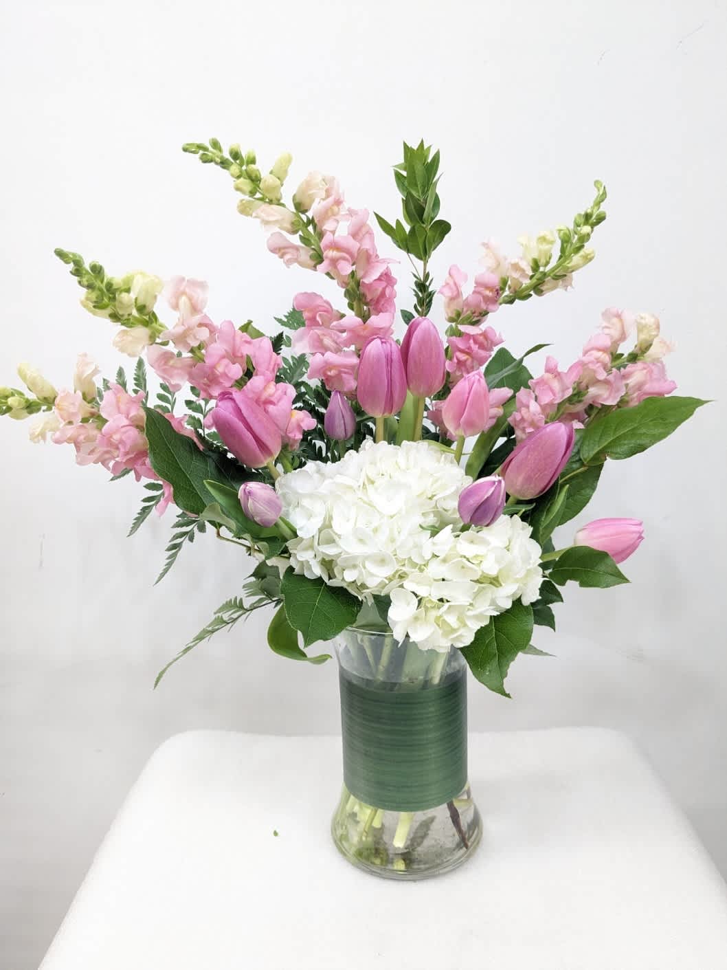 Dear Mom  - Show your appreciation with this sweet, fun bouquet. This arrangement contains white hydrangea, pink tulips, and pink snapdragon. Perfect gift for Mother's Day, Birthday, or Just Because. APPROXIMATE DIMENSIONS: 14&quot; H X 16&quot; W