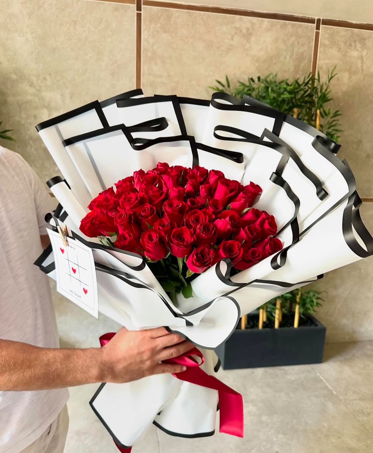 KING OF MY HEART - A beautiful bouquet of red rose wrapped very sophisticated and elegant  Standard 2 dz Deluxe 3 dz Premium 4 dz