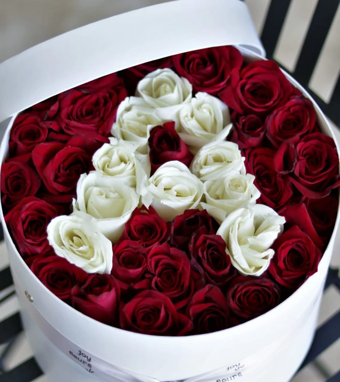 classic roses box - Our beautifully unique floral arrangement that is created with the client in mind. These arrangements include 30-35 roses and can be customized by selecting a box color of your choice and when choosing a floral design for your luxury roses in a box, you have the option to select a roses only arrangement or a mixed floral arrangement. Handwritten card is included. Send the most beautiful flowers for that special someone. Next day delivery available to Tequesta, Jupiter, Palm Beach Gardens and Palm Beach.   At checkout please indicate in florist instructions if you prefer a white or black box as well as the color and shape of roses you prefer.