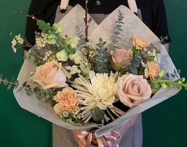 Designer's Choice Fresh Hand Wrapped Flowers - Flowers have a way of making any day extra special. Our designers will pick out fresh flowers and wrap them up for a special delivery. This is a beautiful gift for birthdays, anniversaries, or anytime you wanna show your appreciation. Please specify any color requests in checkout.