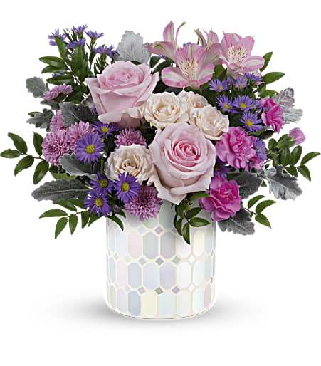 Teleflora's Alluring Mosaic Bouquet - Add a touch of elegance to any space with Teleflora's Alluring Mosaic cylinder, a timeless piece that sparkles with pastel shimmer, perfectly complementing a lush bouquet of pink and purple flowers, making it a cherished centerpiece for years to come.