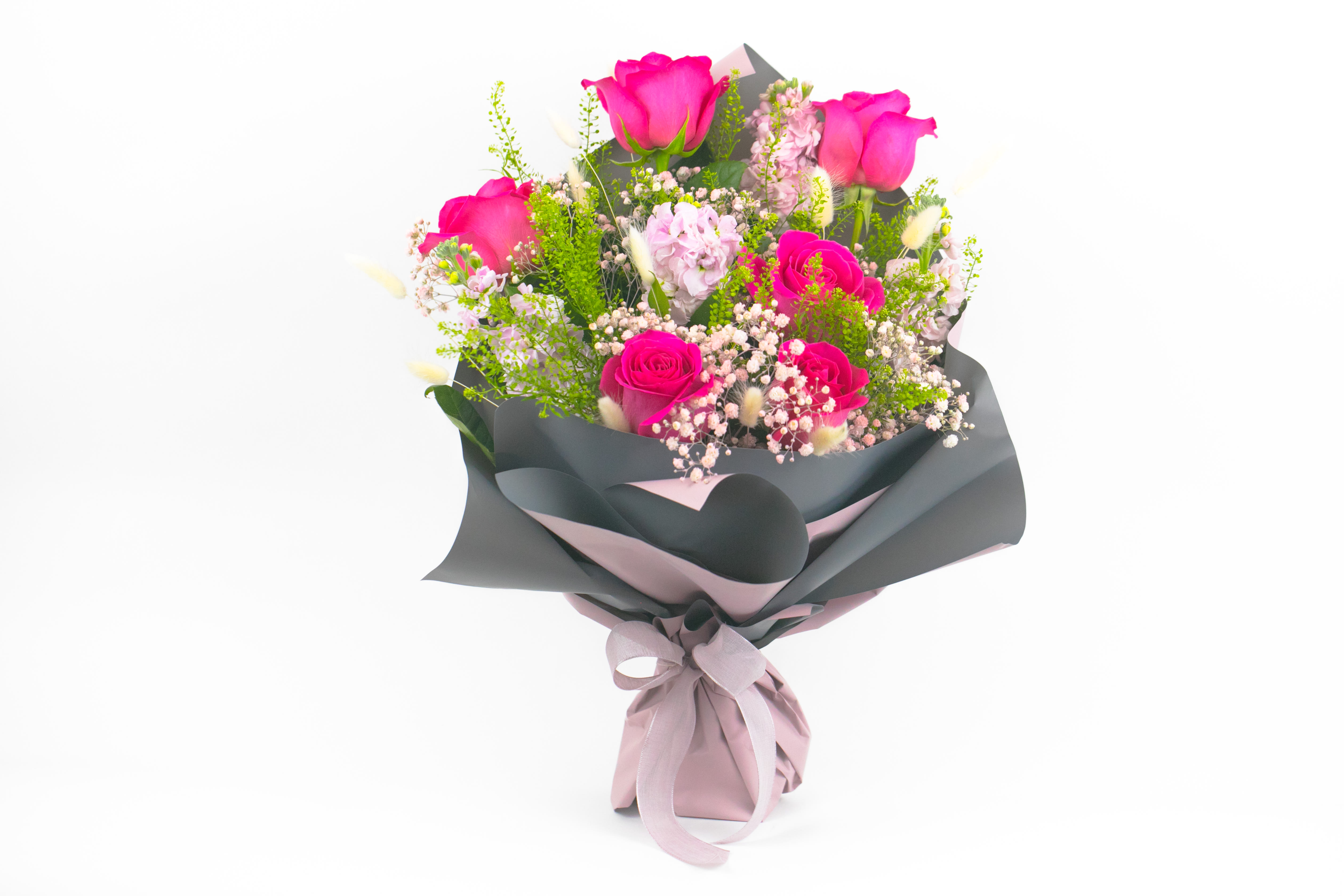 Zephyr Sky - PINK ROSES AND BABY’S BREATH BOUQUET   Classic and gentle. A traditional rose and baby’s breath bouquet in shades of soft and bright pink. Delicate sprigs of white baby’s breath blend with big hot pink roses and frilly, light pink perfumed stock. While stems of ornamental grass give this gift a ‘just-picked-in-the-meadow’ look.  These flowers are perfect for romantics at heart who love traditional styles.  Send this pretty rose and baby’s breath bouquet to say ‘I love you’. Spoil someone for their birthday or simply send as a special thank you.  Why not add a greeting card, bunch of local dried lavender or quality handmade candle to match the occasion or personality?  Zephyr Sky features: ·        Big hot pink ‘Pink Floyd’ roses ·        Light pink perfumed stock ·        Dainty white baby’s breath ·        Perfumed blue hyacinth ·        White bunny tail grass ·        Mini coin eucalyptus ·        Salal foliage ·        Korean Style gift wrap  SIZE: The STANDARD flower arrangement is approximately 14” height and 14” width.   ALLERGY ADVICE: This design has moderate pollen and a moderate fragrance.     FAQ Q: What time will my flowers arrive and what if no-one is there to accept them? A: Excellent question! We’re unable to provide or guarantee specific delivery times. All our flowers are delivered anytime between 9-5pm, with exception to Sympathy designs for a funeral service. For full details around our delivery process and timings, please see our Terms and Conditions. Q: What days do you deliver flowers? A: All our flowers are available for San Francisco and Daly City delivery seven days a week, between 9am-5pm. Q: May I order for the same day delivery? A: Yes, same day deliveries are available if you place an order before 1pm. Q: May I request to change the design a bit? A: Yes, please make a note in the SPECIAL INSTRUCTION box when you place your online order. We will do our best to follow them. Q: Will my flowers look exactly as what is pictured? A: Depending on the season, colors or shades may vary. Sometimes we need to substitute flowers due to seasonal availability, but they’re always substituted for the same or greater value.   Ready to bring floral beauty into someone’s world with this beautiful Zephyr Sky bouquet? Order this gift online now or give us a call on (415) 752-2060 if you have a question or special request. 