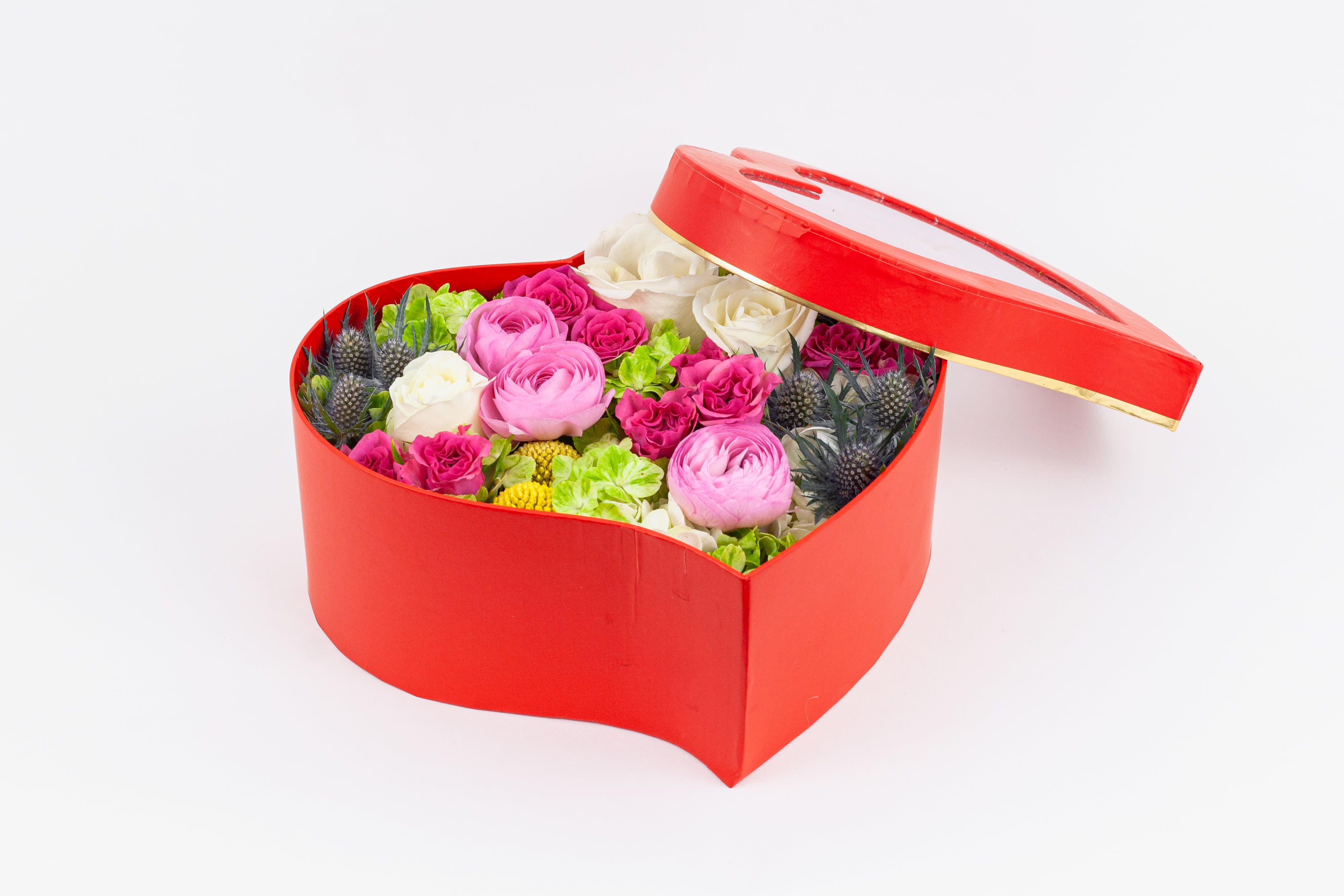 Blooming Heart - Show how much you care with a romantic collection of ranunculuses, roses, and hydrangeas in a heart-shaped box.