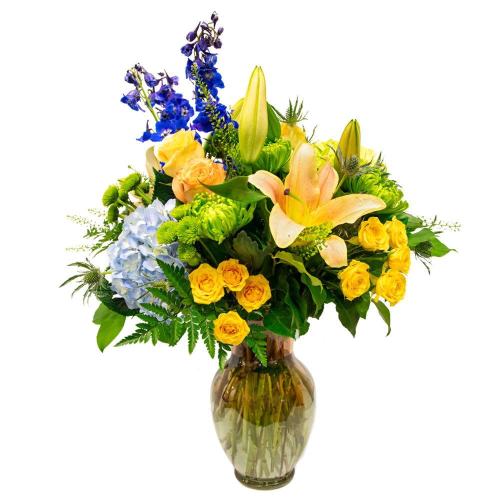 Crystal Cove - Dive into a world of elegance with our &quot;Crystal Cove&quot; floral arrangement, featuring exquisite roses, lush hydrangea, and delicate blue flowers that evoke the serene beauty of coastal landscapes. This captivating bouquet adds a refreshing splash of color and sophistication to any space, perfect for brightening your home or enhancing special occasions.