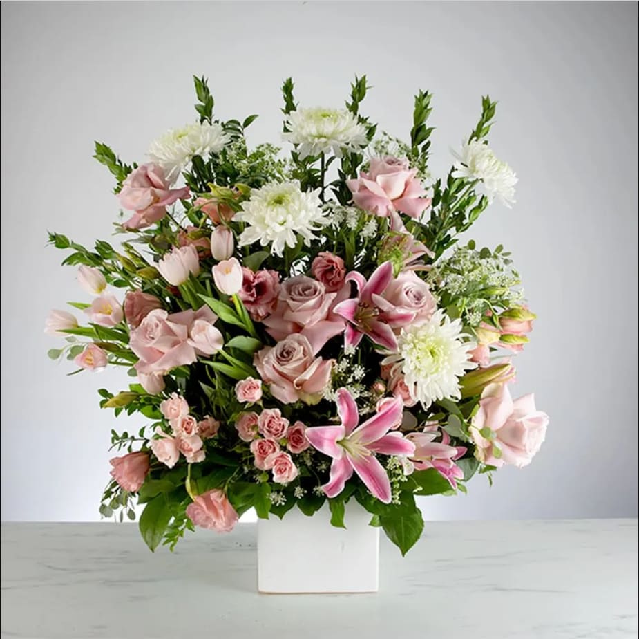 Harmony by BloomNation™ Harmony by BloomNation™ - This pink and white funeral basket is a lovely sendoff and tribute. Fitting for any type of ceremony.