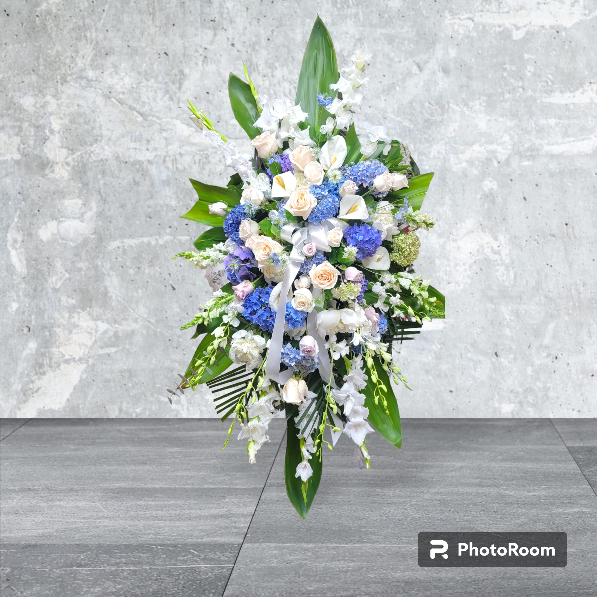 Peaceful Spray Peaceful Spray - Blue hydrangea, white snapdragon, white calla, white gladiolus, white dendrobium, ti leaves,