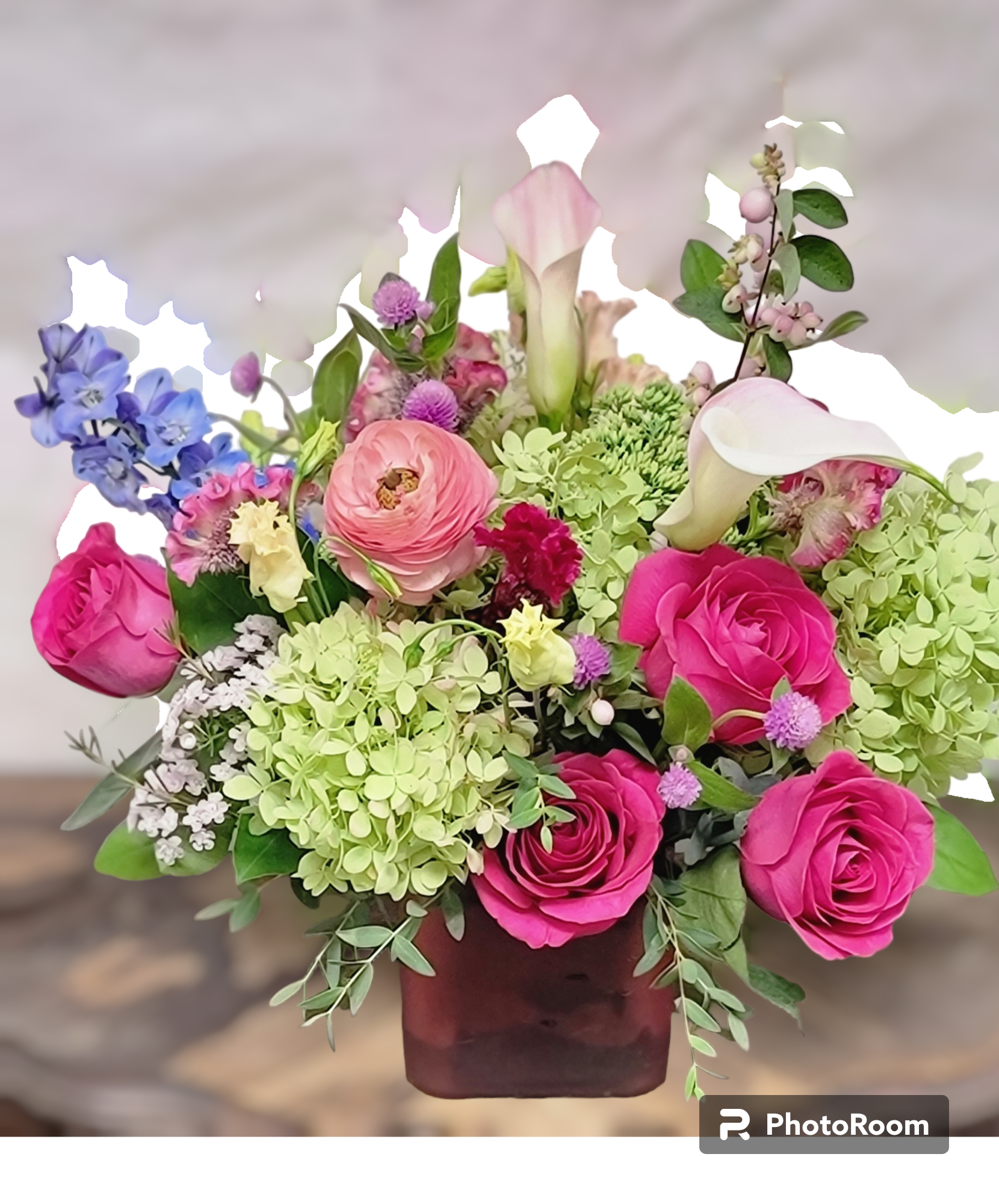 Pink Family Pink Family - Mini Calla lilies, Blue Delphinium, Green Hyudreangea, Pink roses, ranunculus