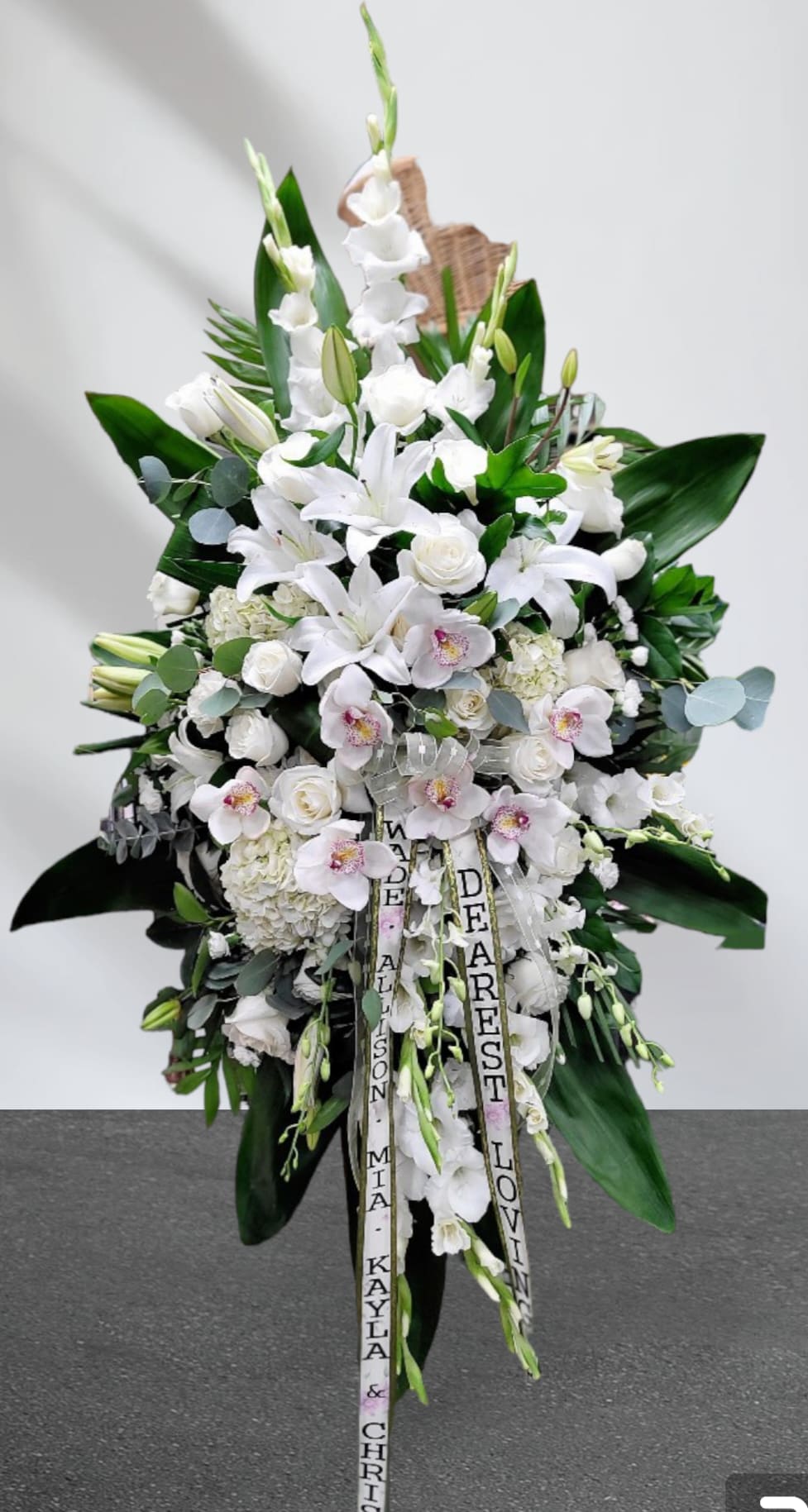 White tribute White tribute - Cymbidium. Gladiolus. Lily. Roses. Green