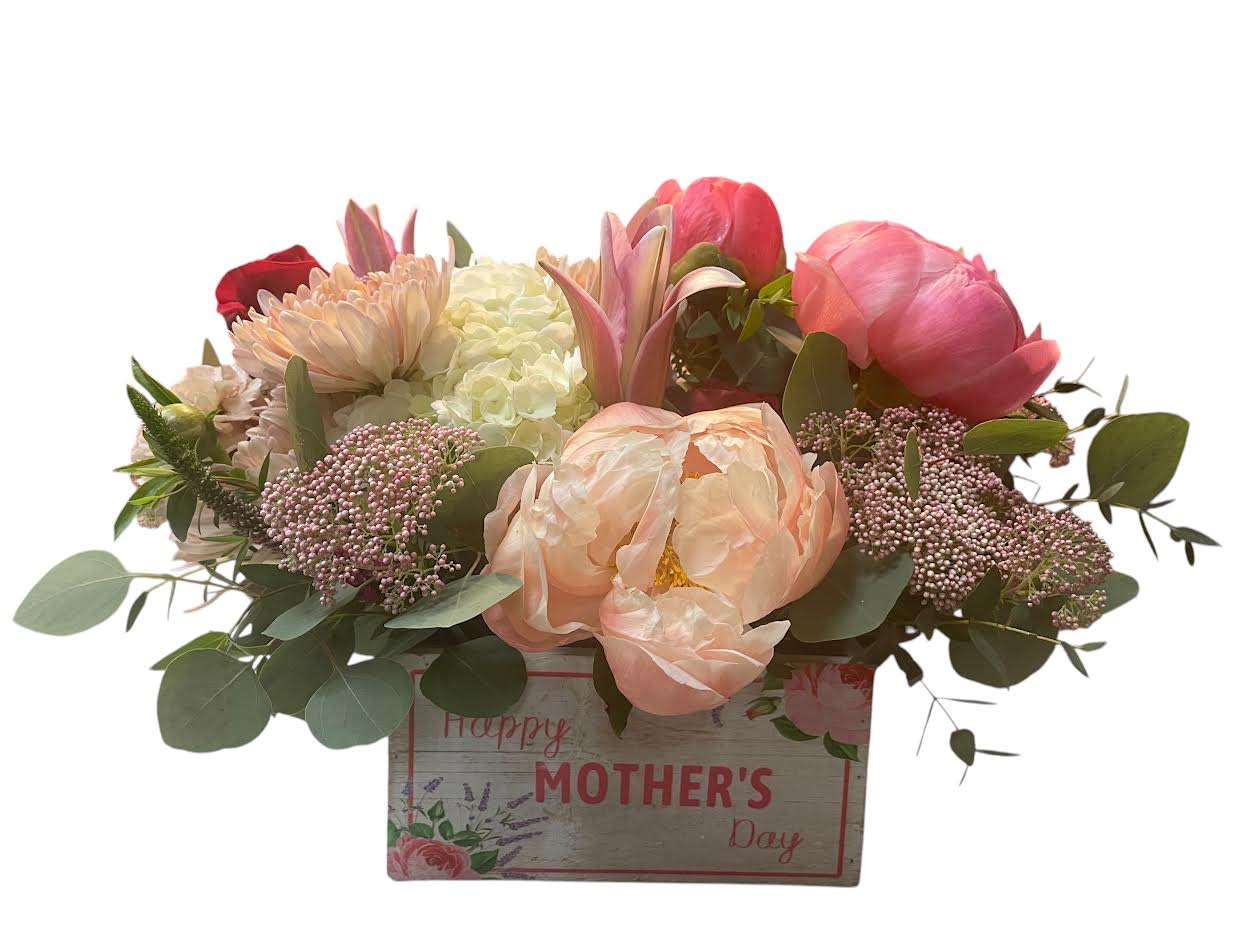 Grateful Garden for Mom - Let them know how much you appreciate them with our Grateful Garden arrangement!  This lush boxed bouquet features all the bright colors of Springtime,  all gathered in a gorgeous keepsake!  Substitution Policy In some instances, our photo may represent an overall theme or look and include a one-of-a-kind vase which cannot be exactly replicated.  Although the actual bouquet may not precisely match the photo, its temperament will. Occasionally, substitutions of flowers and/or containers happen due to weather, seasonality and market conditions which may affect availability. If this is the case with the gift you’ve selected, we will ensure that the style, theme and color scheme of your arrangement is preserved and will only substitute items of equal value or higher value.  If any design elements are of major importance to your order, please include them in the florist instructions at checkout or contact us to ensure availability.