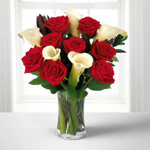 Memorable Moments Bouquet with FREE Vase - 13 Stems Memorable Moments Bouquet with FREE Vase - 13 Stems - This stunning bouquet of red roses and white calla lilies make an elegant combination for your recipient to admire. Accompanied with a stylish glass vase this gift expresses every last heartfelt wish.