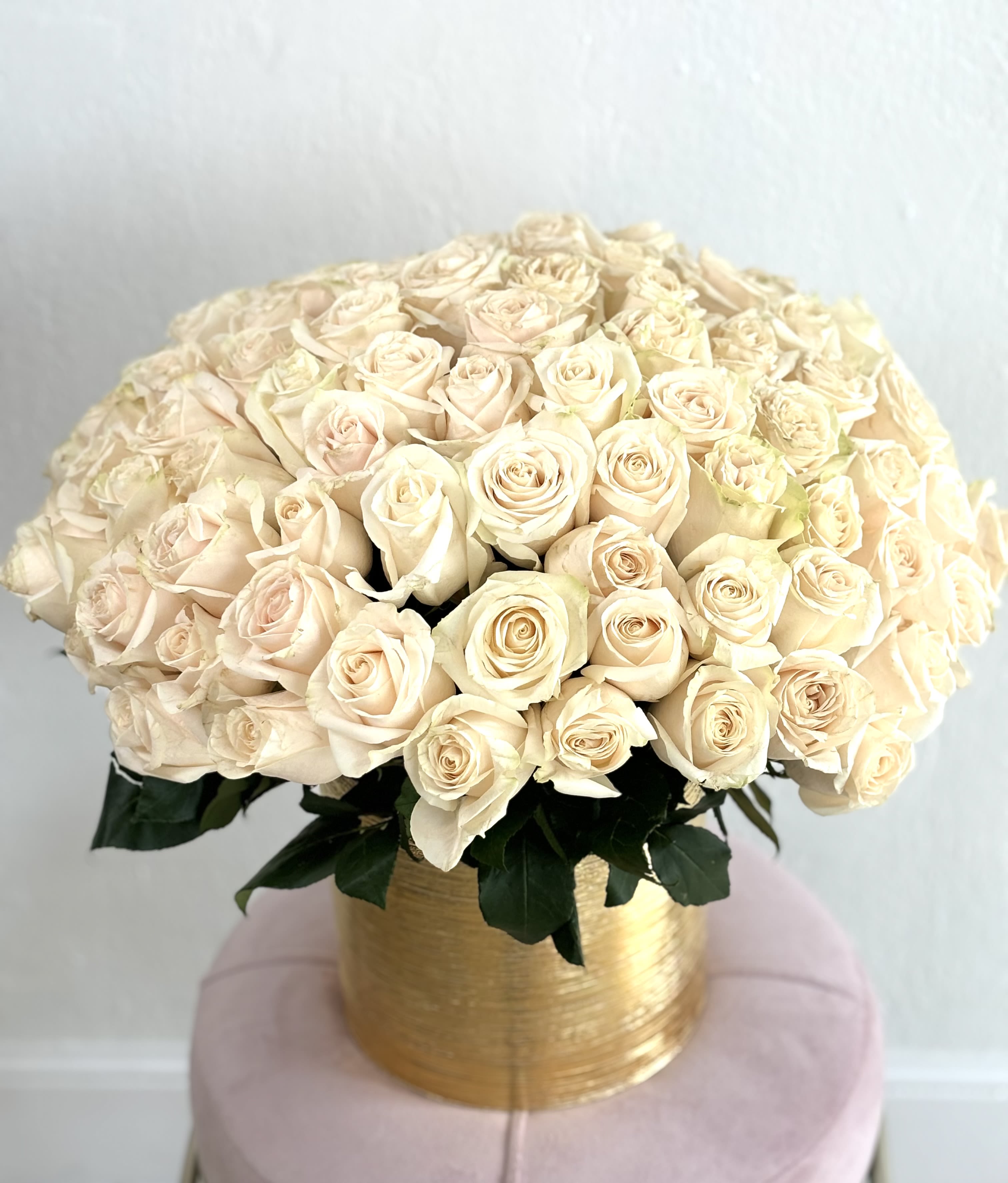 Ambar  - Beautiful golden vase filled with white roses