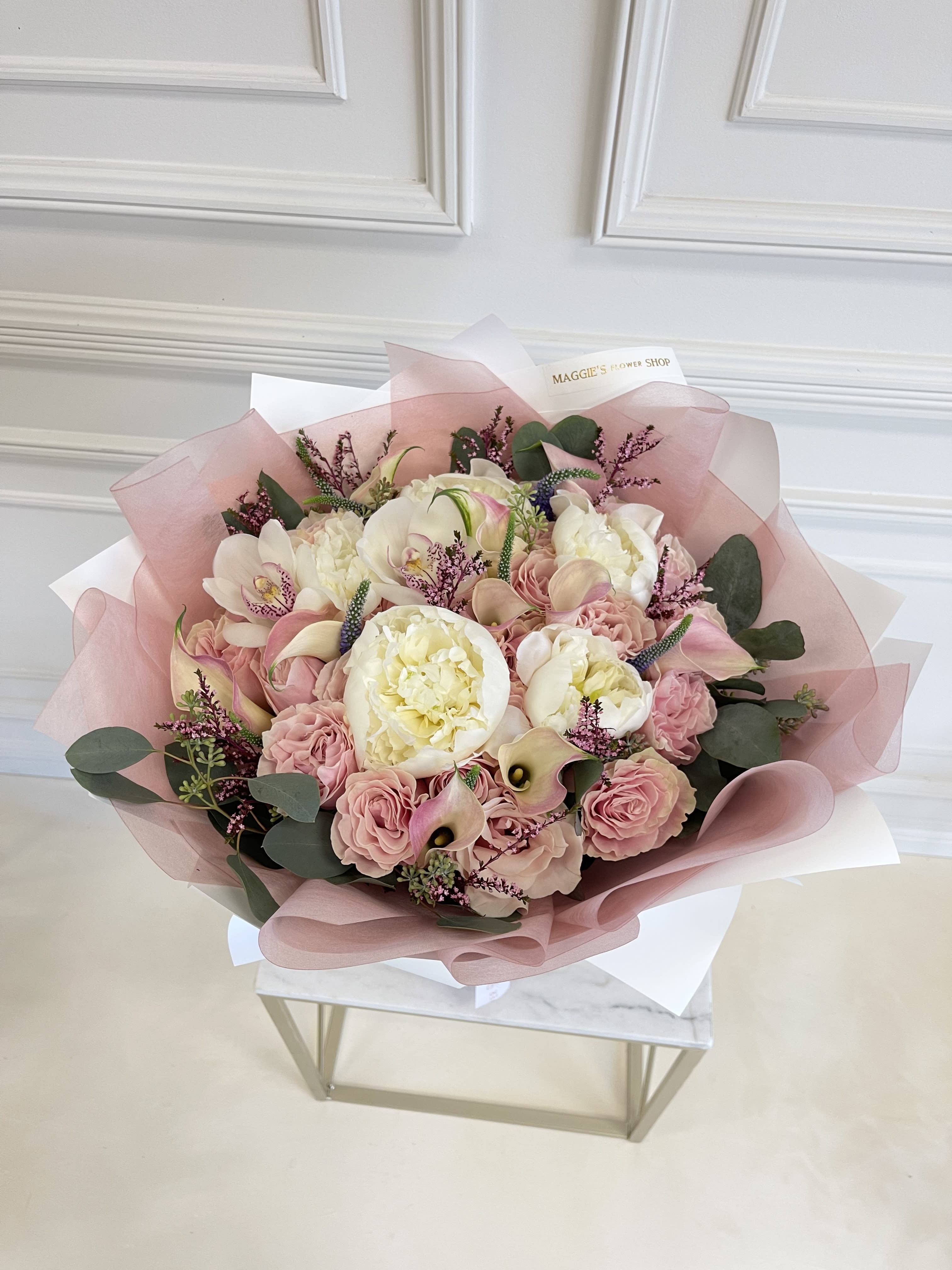 MFS Ballerina Pink Bouquet MFS Ballerina Pink Bouquet - Mondial Pink Roses Peonies Calla lilies Orchids Seasonal filler flowers (will vary depending on season) *Bouquet does not include glass vase #225