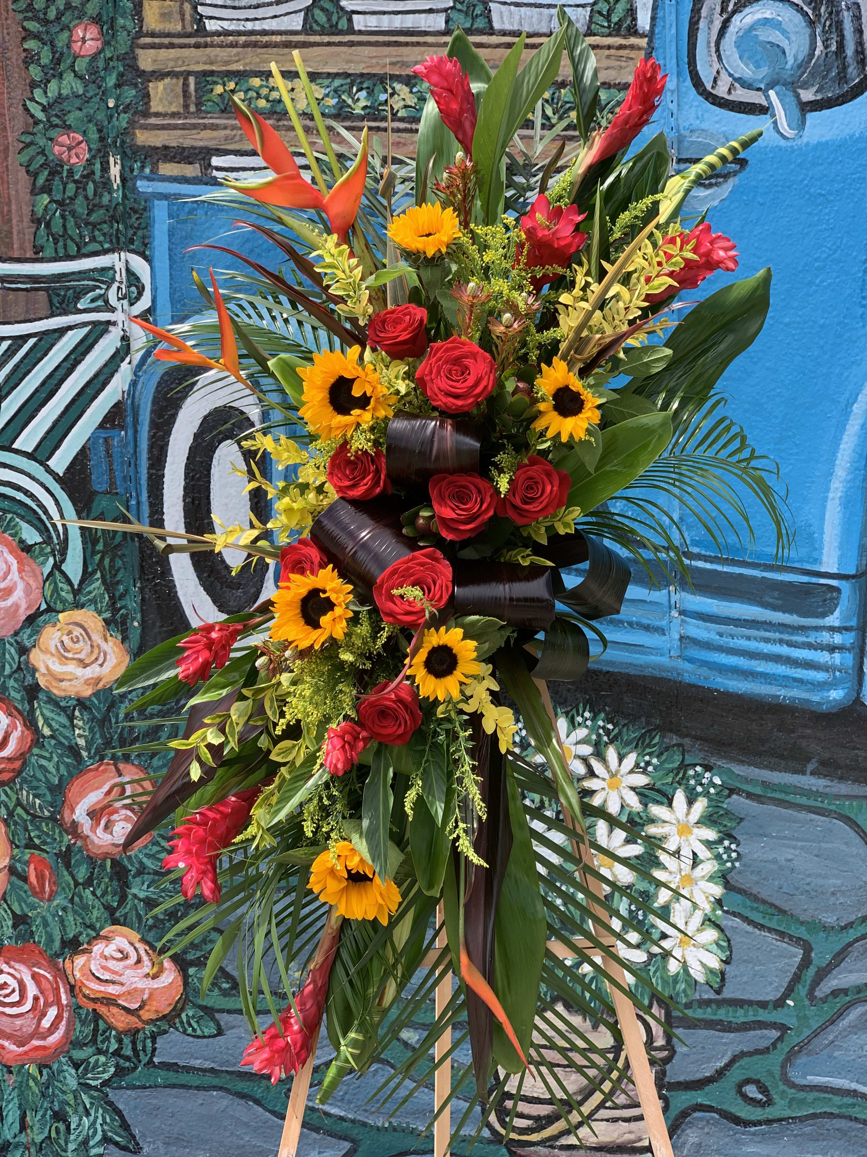 Tropical Remembrance Tropical Remembrance - Seasonal tropical flowers arranged in spray.
