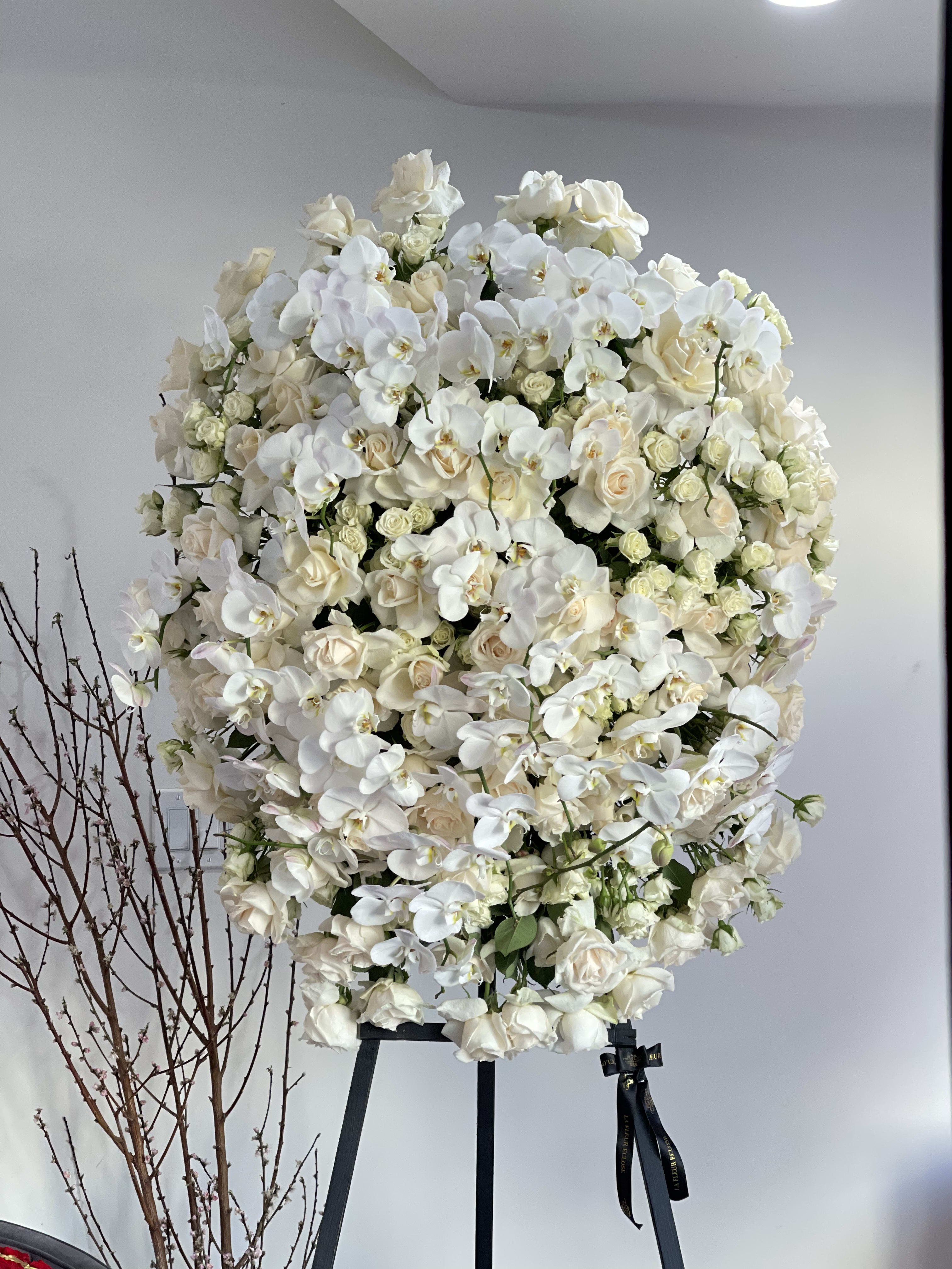 Funeral song  - Funeral with white roses, white spray roses and orchids on the top