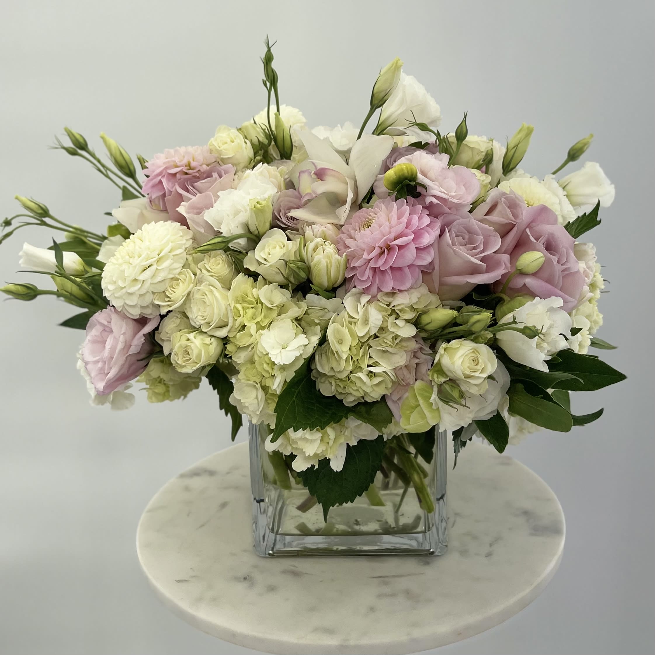 Prettiness  - Pastel arrangement of the fresh flowers in a glass vase 