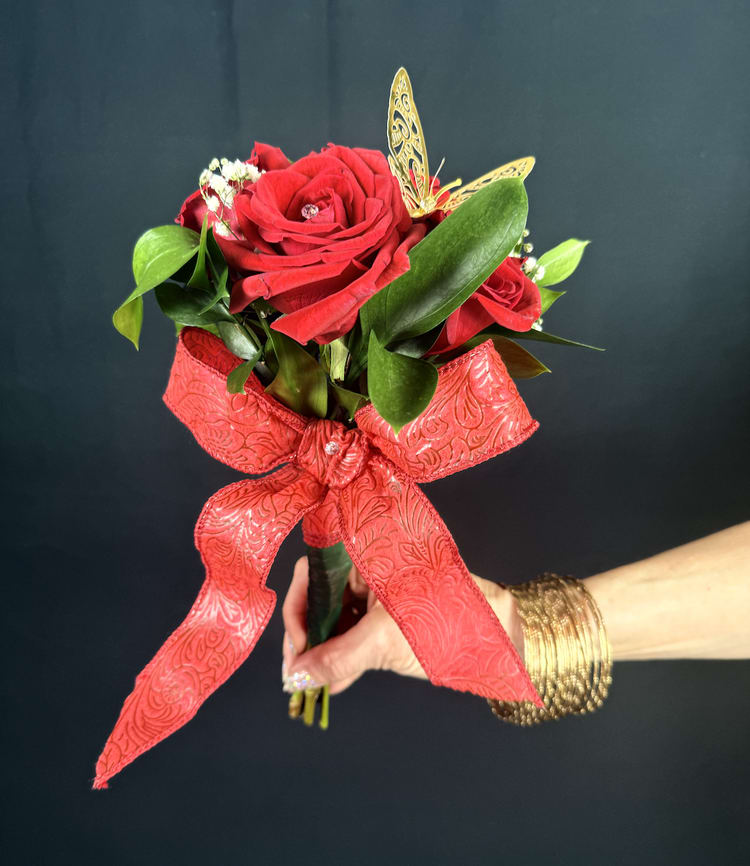 6-Roses Small Cute Bouquet - The Little Princess  This charming little bouquet may be small in size, but it’s big on impact! With six delicate roses, each adorned with sparkling stones that catch the light, it radiates elegance and grace. Topped off with a whimsical butterfly and wrapped in a beautiful red bow, this bouquet is the perfect combination of sweet and stunning. It's a small gesture that truly speaks volumes, making it a meaningful gift that will brighten anyone's day. Small but mighty, it’s sure to leave a lasting impression.  It also comes with a small message card from the sender, allowing you to personalize your gesture with a heartfelt note.