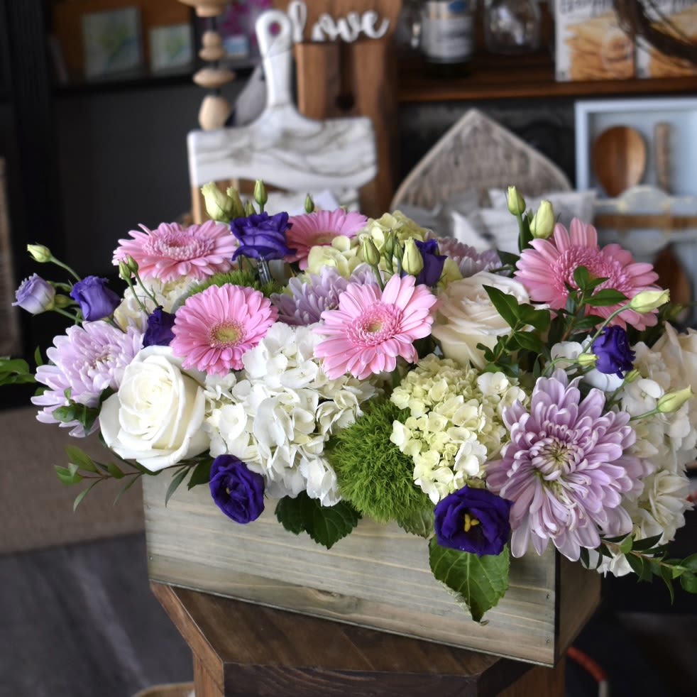 Love and Happiness - Each arrangement is custom designed using seasonal, best-of-day blooms. The image shown represents its size, style and temperament, however certain florals or greens may be substituted to achieve the best quality and longevity.