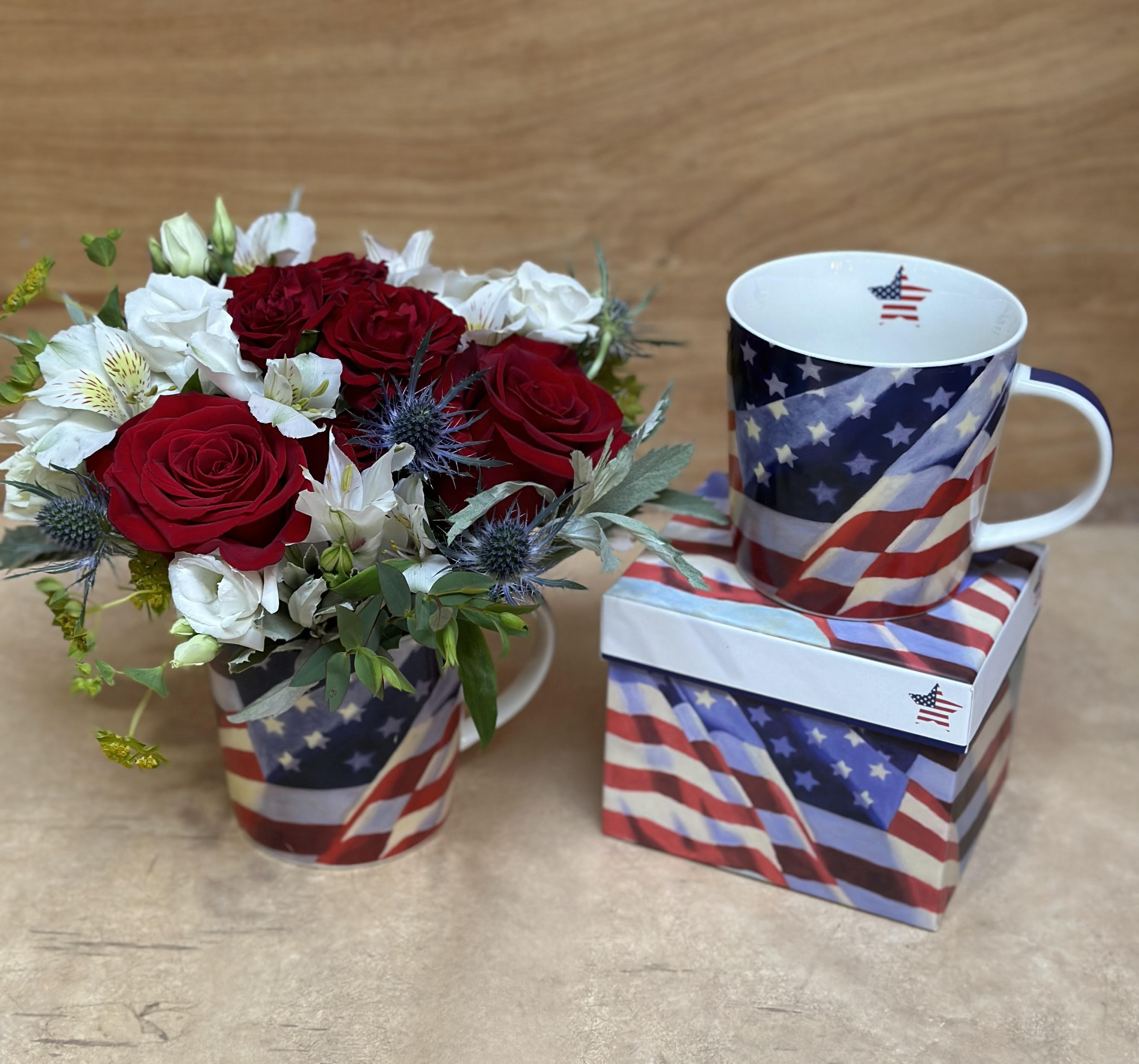 Patriotic Mug Patriotic Mug - A beautiful selection of red, white and blue flowers will be arranged in this vibrant flag themed 14oz ceramic mug. The mug is dishwasher and microwave safe.