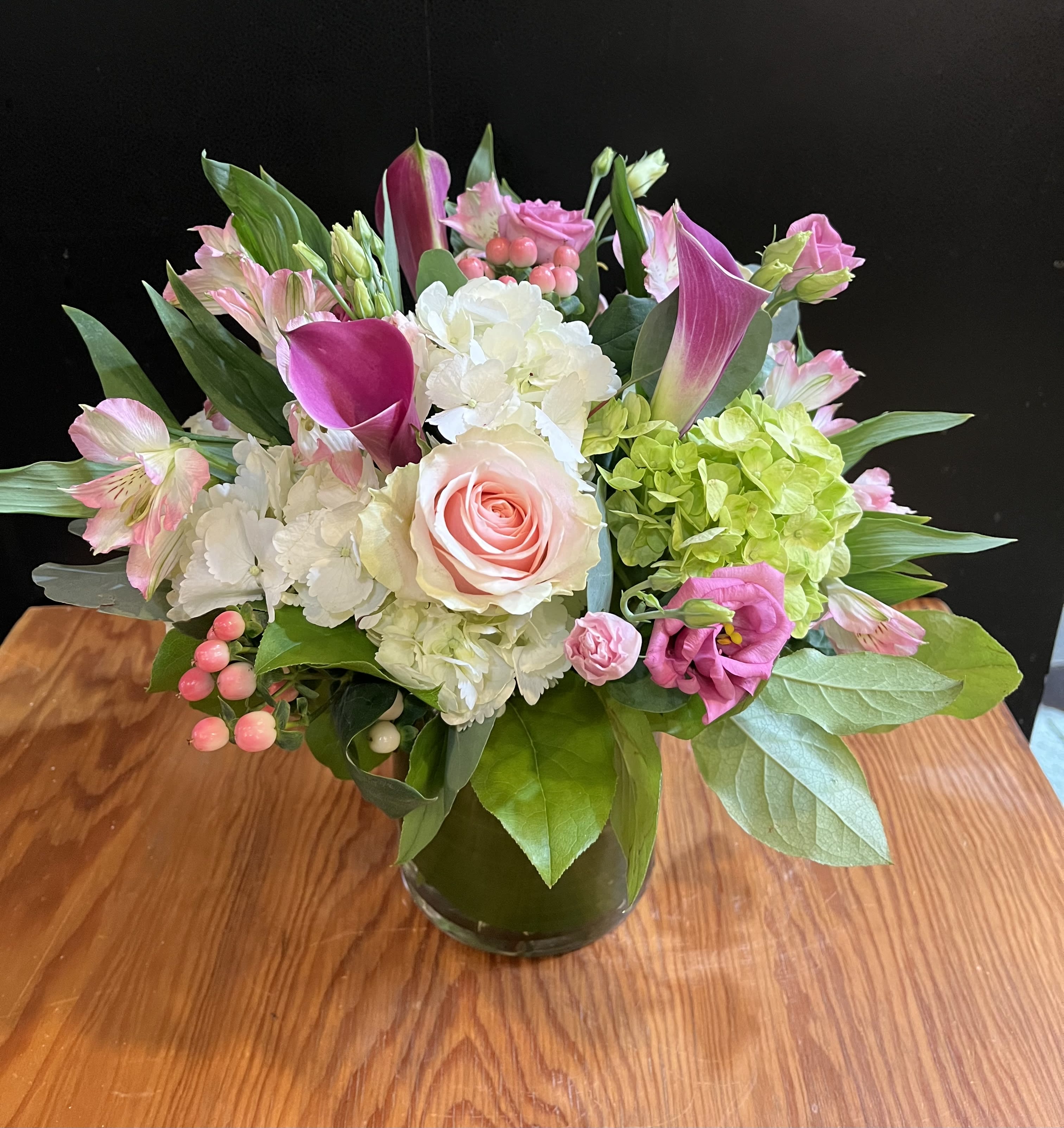 Romance  - A beautiful blend of romantic shades of pink and white florals ( flower variety will vary ) gathered in a glass vase.... Hydrangea, roses, mini calla,    Approx 13”h 