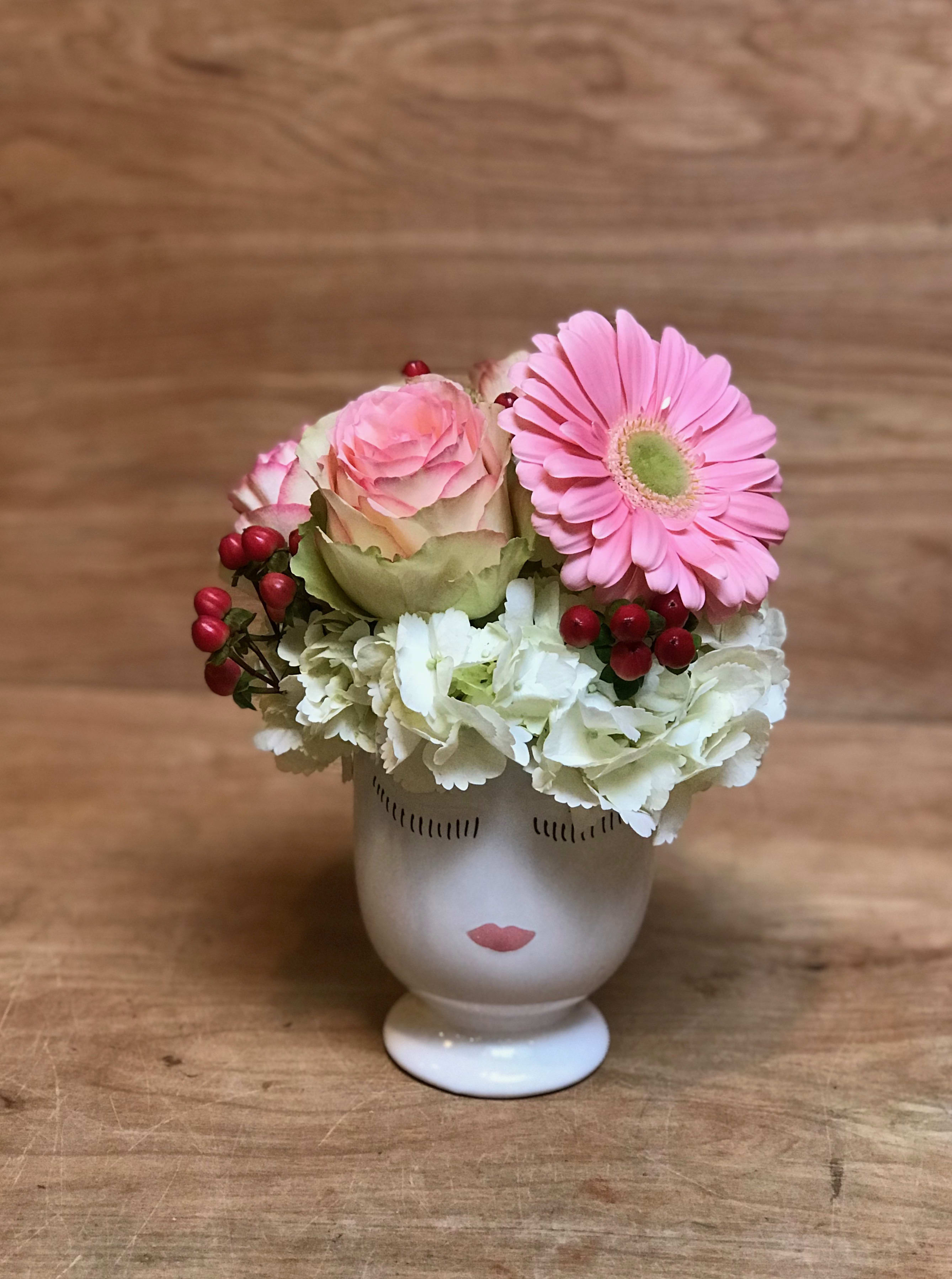 Valentina Valentina - Hi i'm Valentina , I'm so cute and sweet...I will certainly put a smile on anyones face! Filled with hydrangea , Gerbera daisy , Roses and berries. After the flowers fade you can use the container for makeup brushes , lipstick, pens..etc . Approx. 10" high