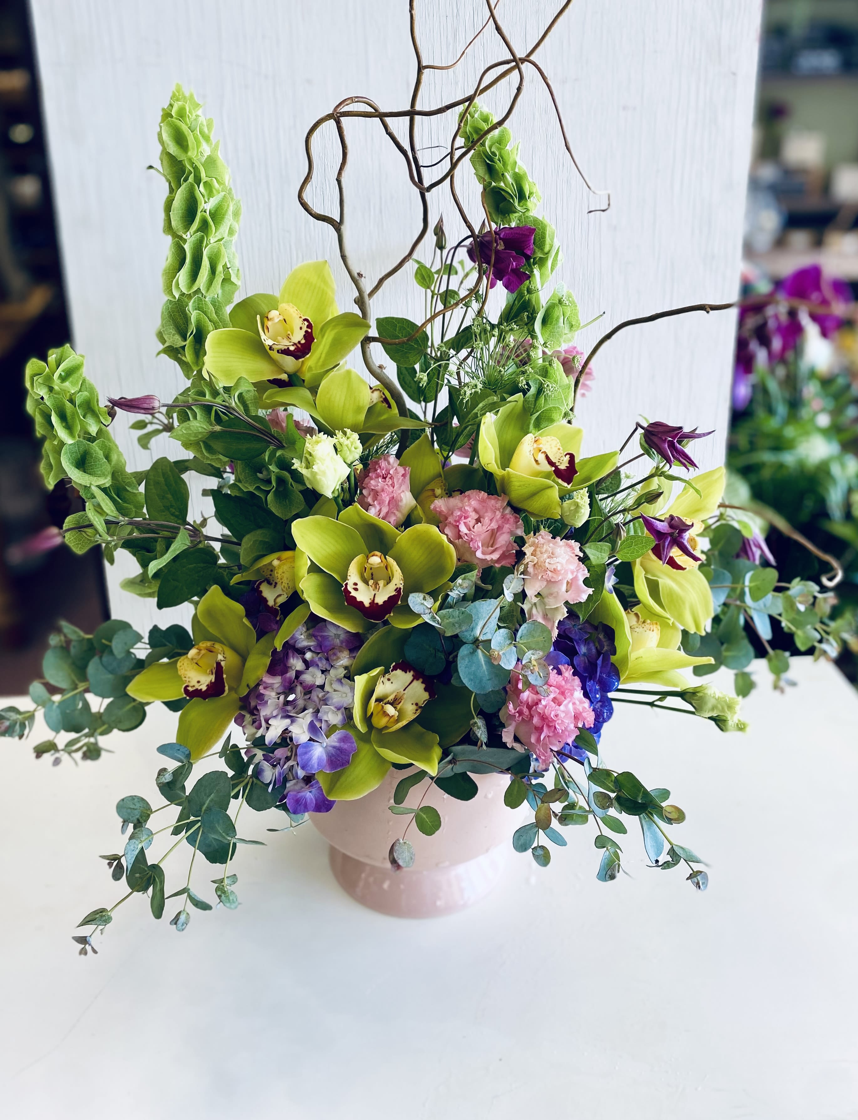 Daydreams Daydreams - Gorgeous Cymbidium orchids are the stars in this stunning arrangement!