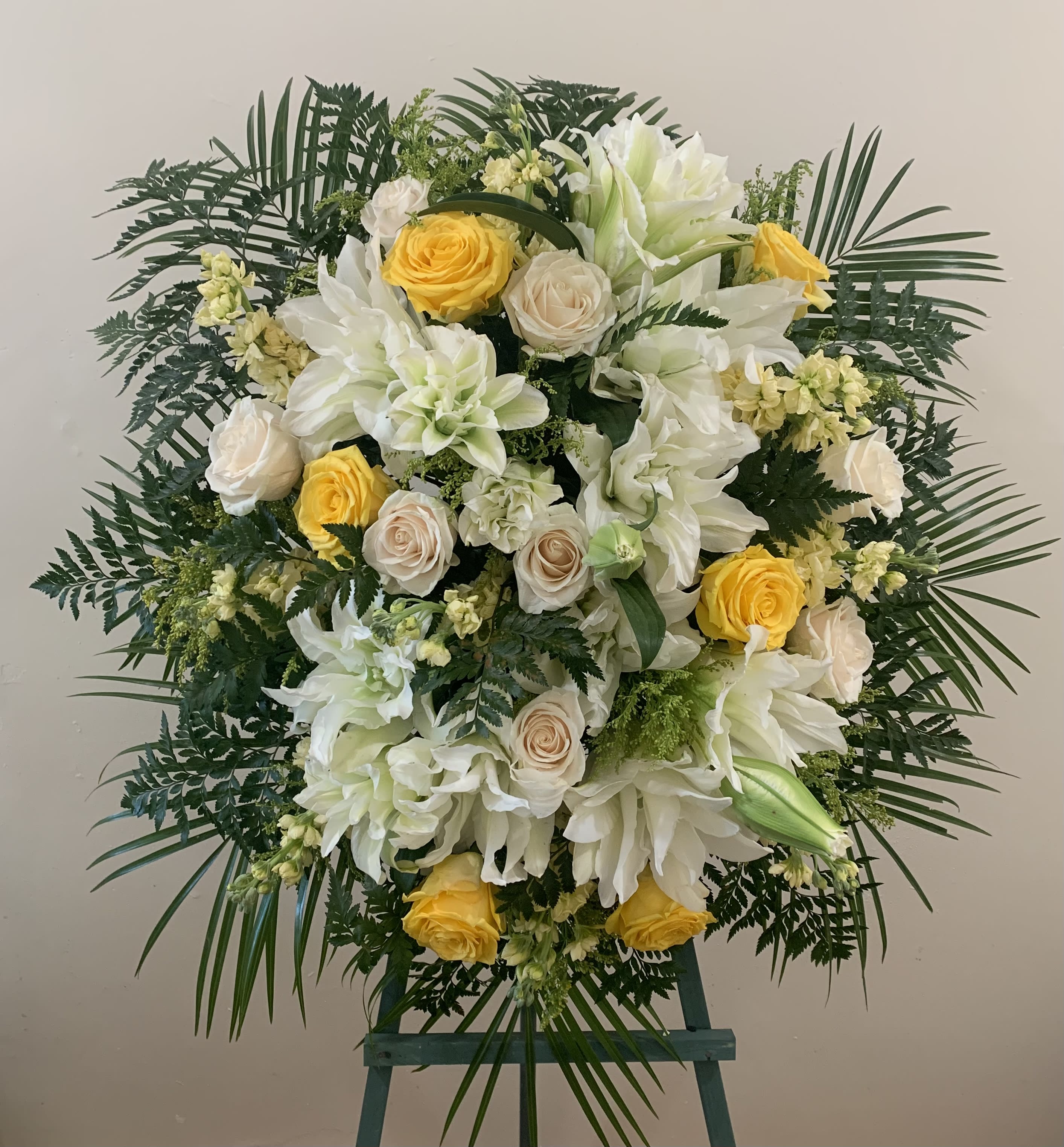 Yellow and White Funeral Spray Yellow and White Funeral Spray - A unique spray with various yellows will bring a smile to anyones face in times of sorrow. Plenty of blooms and blossoms fill this spray with love.