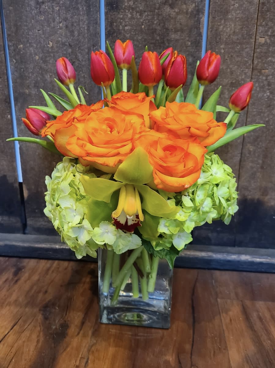 Green and Orange Delight Green and Orange Delight - Luscious colors are sure to please. Have a specific color or flower in mind? Let us know what it is, and we will gladly satisfy your needs.