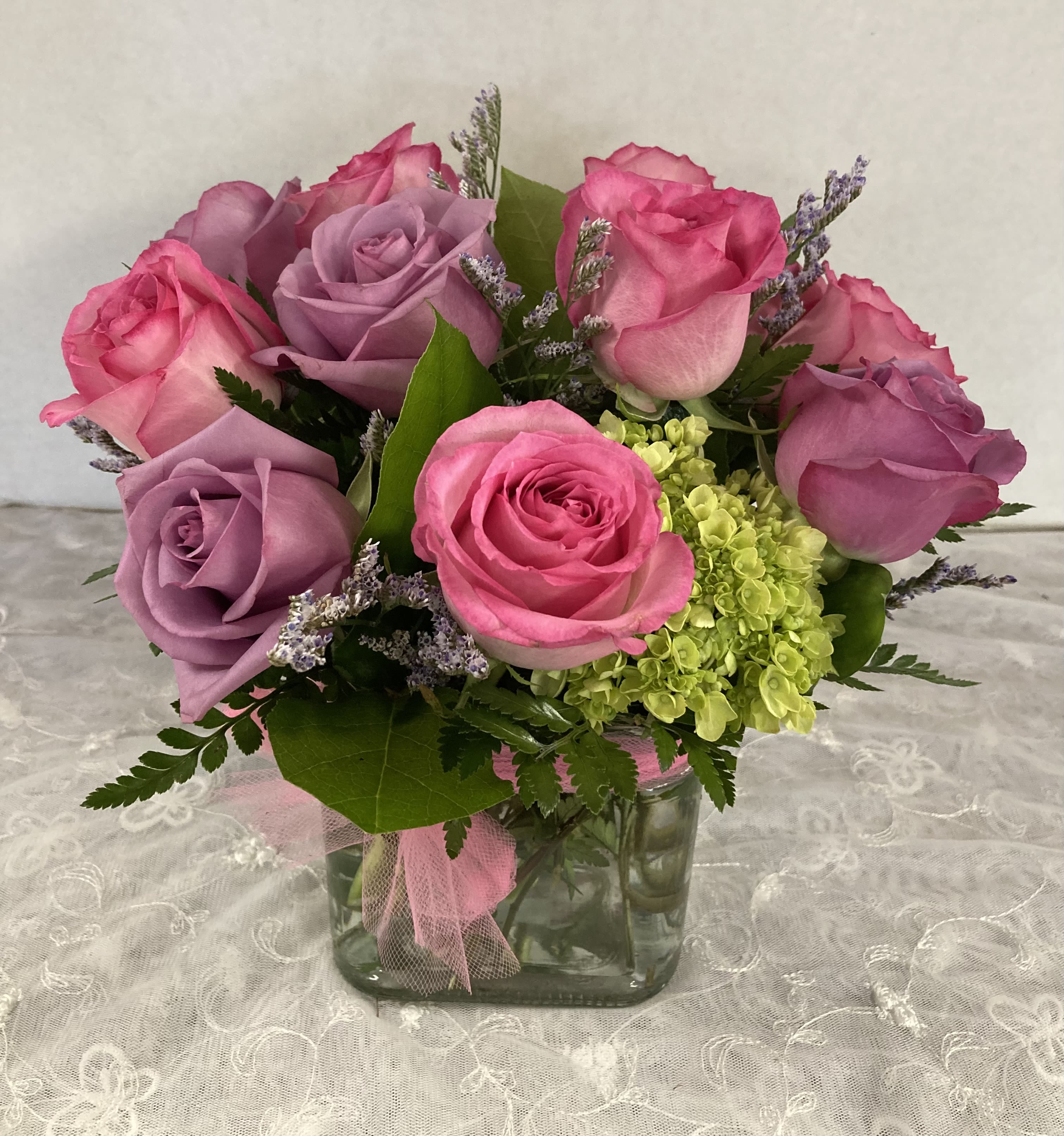 A Rosy Day by Candlelight &amp; Roses - Stylish bouquet of a dozen pink &amp; lavender roses and green hydrangea. Modern stylish design adapts to many occasions, birthday's, anniversary, just because and more. Available today for pick up and delivery