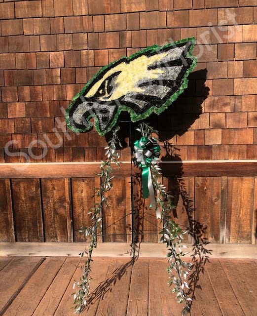 Eagles Logo  (Any Team) - Wanna make a statement? Here is our huge Sports Team Logo made out of flowers. This piece measures approx 40 inches across and 30 inches high (size may change depending on logo selected) Presented on a tall easel. Can be used for a party, corporate event, birthday, or sympathy. (We require 48 hours notice to create this piece)