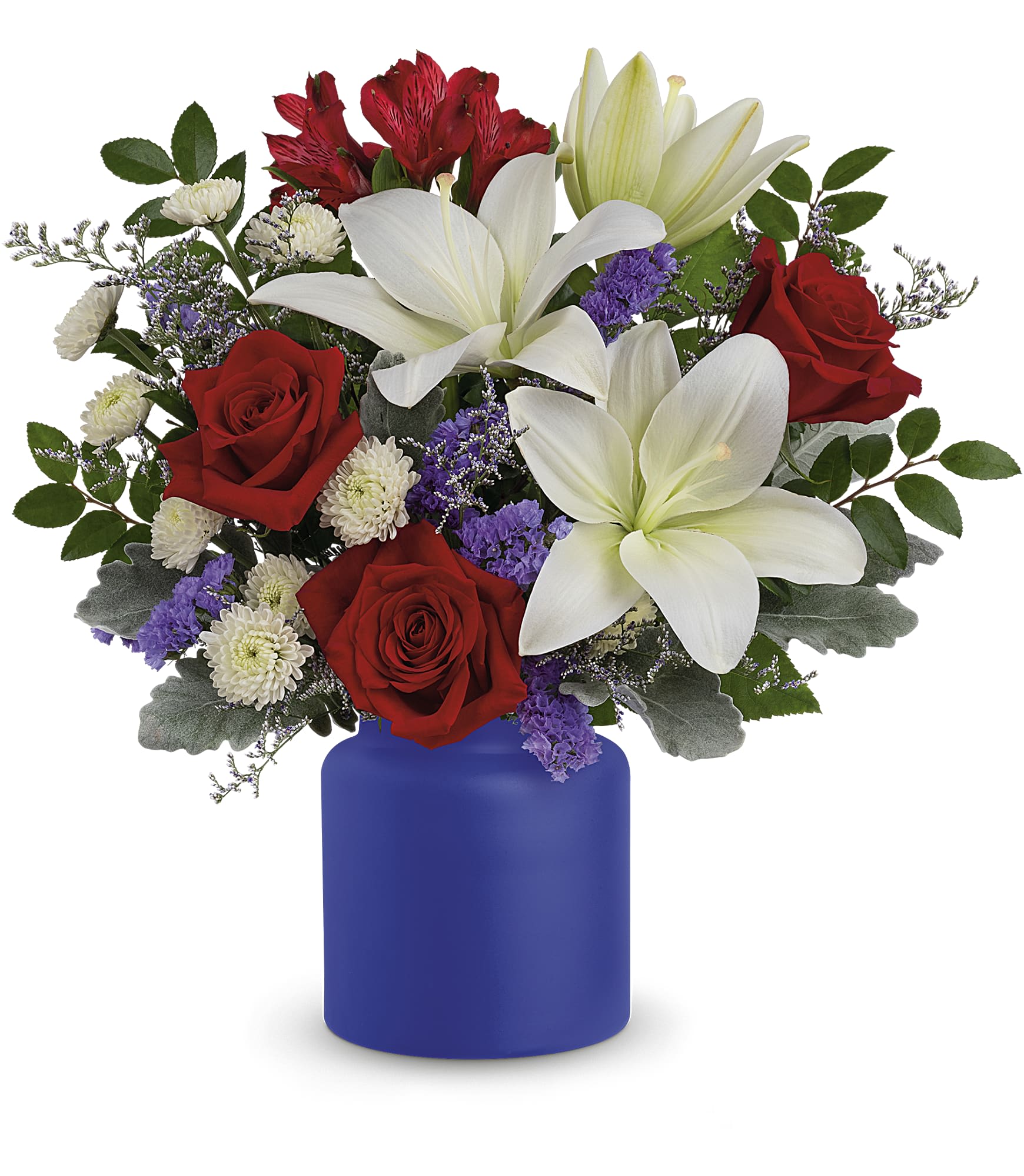 Rose Revelry Bouquet - Revel in the crisp, classic color scheme of pristine white lilies and radiant red roses, presented in a cobalt-hued, frosted glass jar. White asiatic lilies, red roses, red alstroemeria, white button spray chrysanthemums, purple sinuata statice and misty blue limonium are accented with dusty miller and huckleberry. Delivered in Teleflora's Savannah Jar. Approximately 17 1/2&quot; W x 16 3/4&quot; H Flower color and variety subject to availability. 