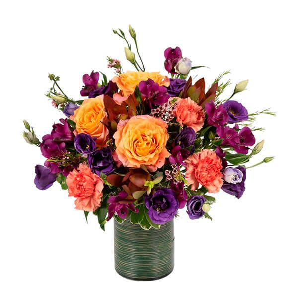 Nightshades - Introducing &quot;Nightshade,&quot; a mesmerizing floral arrangement that boasts a captivating blend of dark purple flowers, vibrant yellow roses, and an assortment of other colorful blooms. This unique combination creates a visually stunning display that captures the essence of elegance and contrast. With our same-day flower delivery, you can promptly share the allure of Nightshade, making it a perfect choice for adding a touch of mystery and vibrancy to any occasion. Order now to experience the enchanting beauty of this floral masterpiece, where dark purples and bright yellows come together in a harmonious dance of colors.