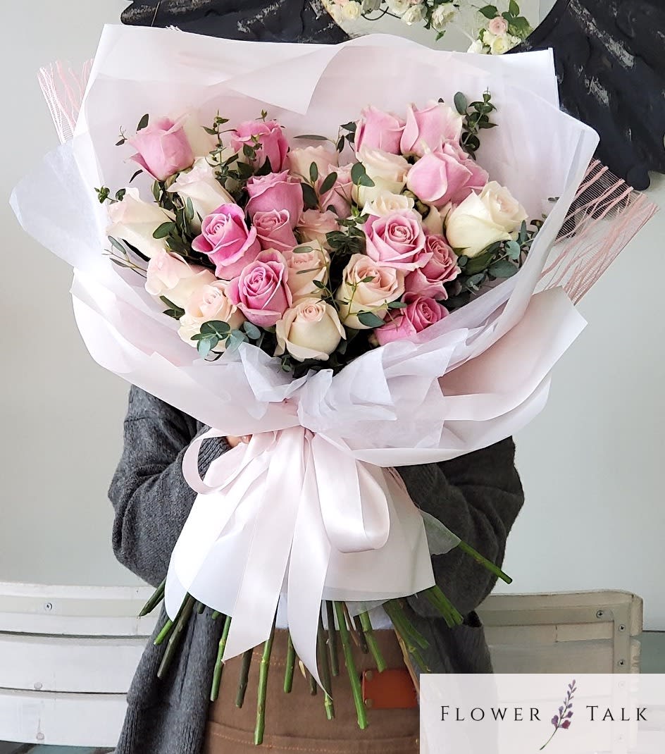 Pink Promise Bouquet (Vase not included) Pink Promise Bouquet (Vase not included) - This bouquet is an extravagant display of pink and peachy roses! Note: Hand bouquets do not include a vase.