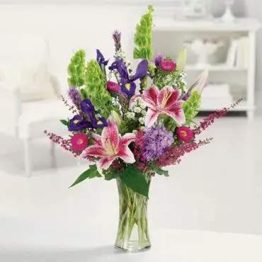 Stargazer Garden - Stargazer Lily, bells of Ireland, Monte casino asters, matsumoto asters and iris liatris ,and purple stock. Just a heavenly mix of lovely.
