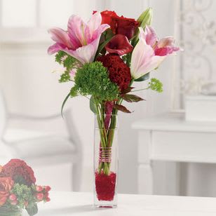 Lilly Greetings Lilly Greetings - Let this sleek vase of lilies delights carry your warm wishes on their merry way!
